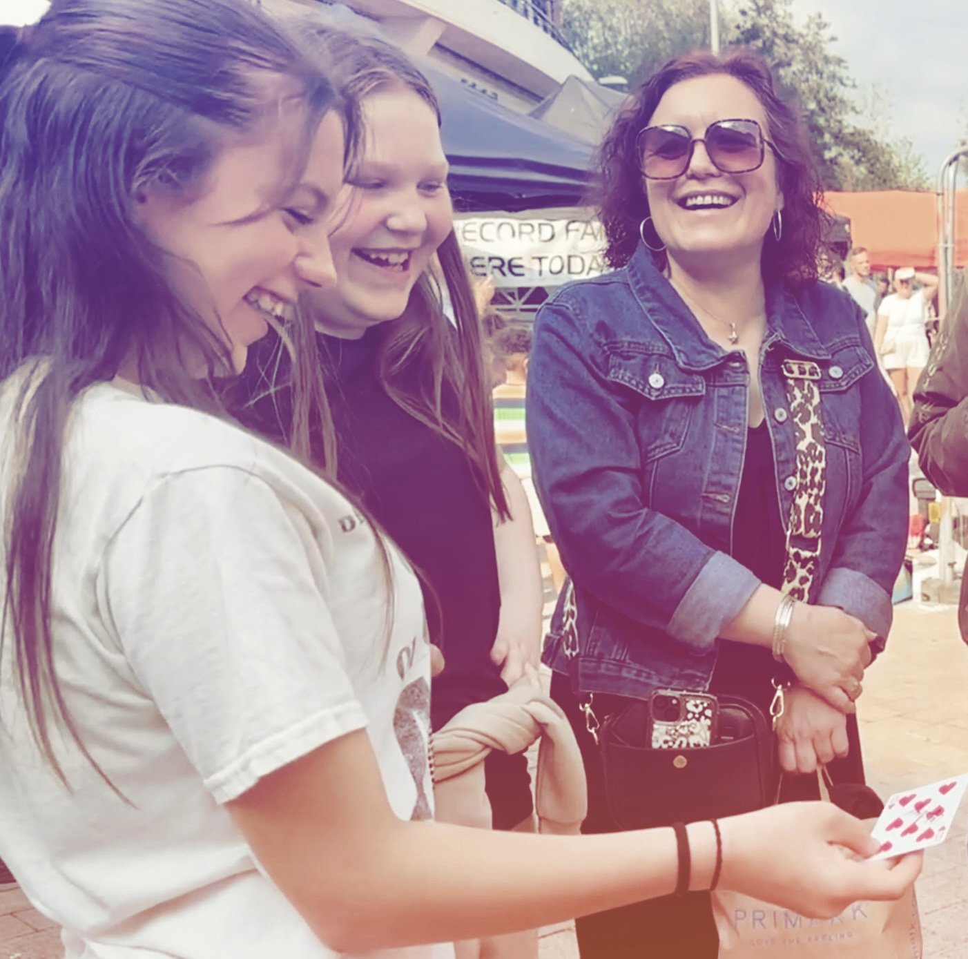 Family reacting to close-up magic.