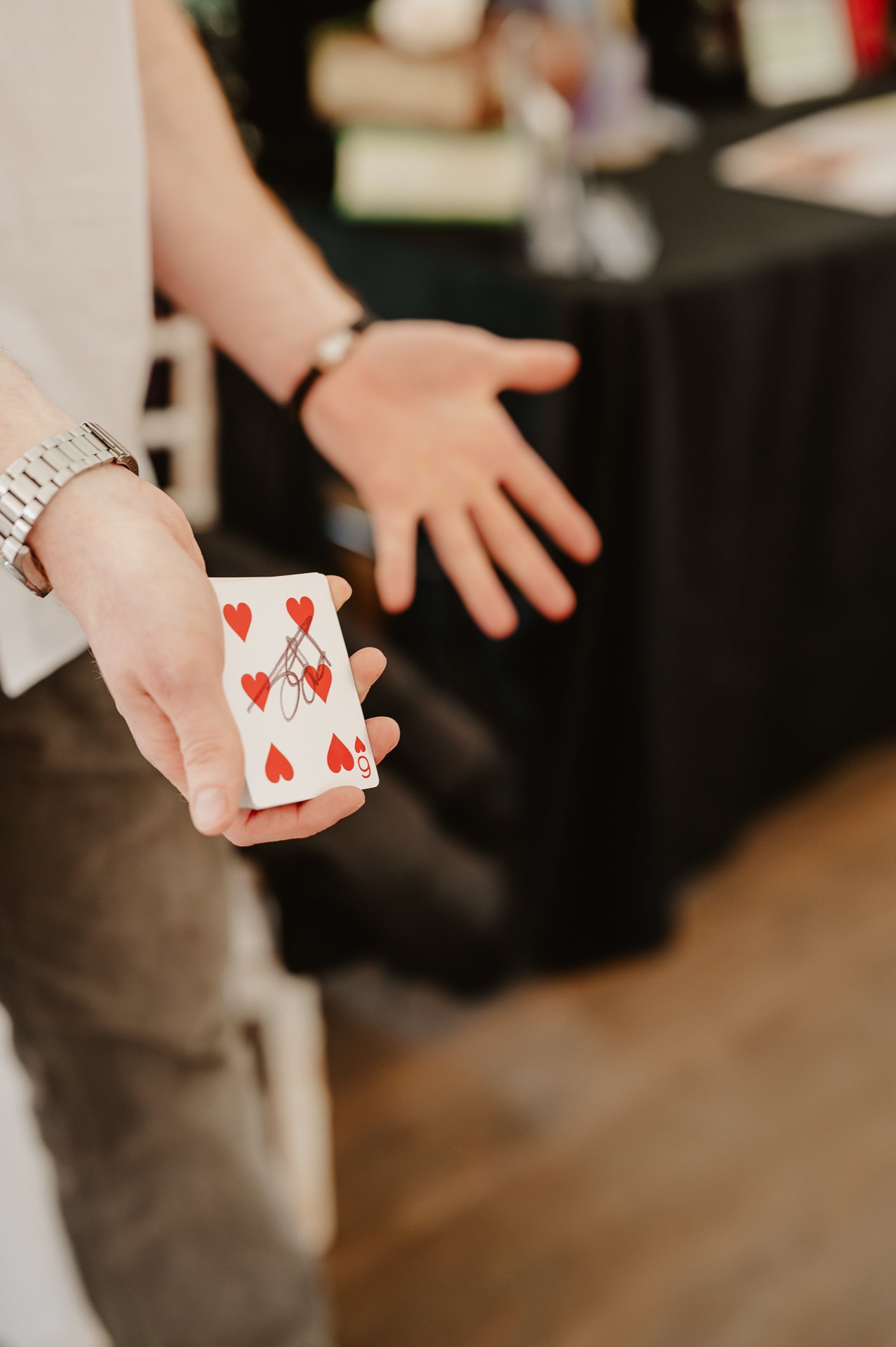 Close-up magician with cards.