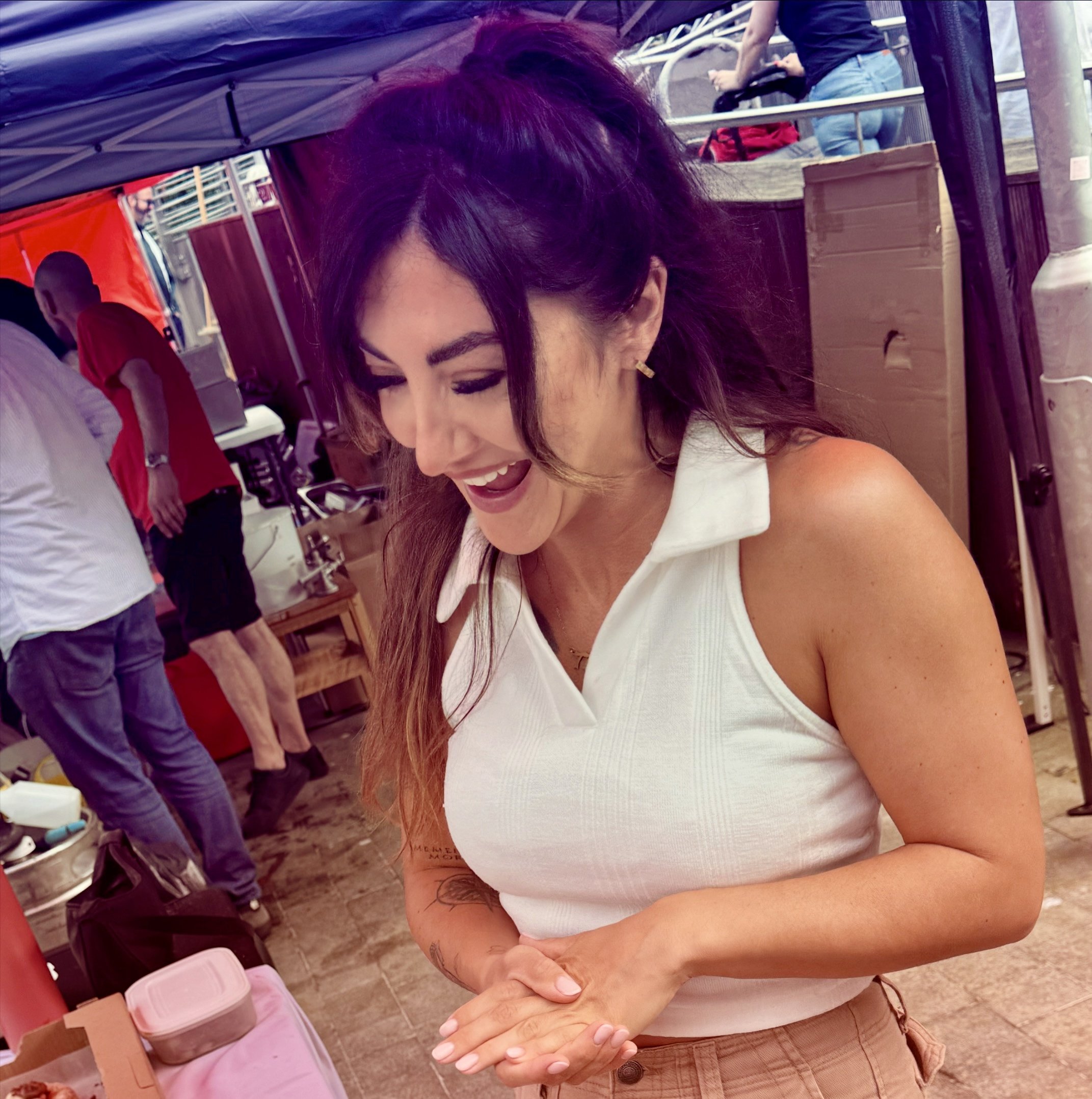 Woman reacting to street magician.