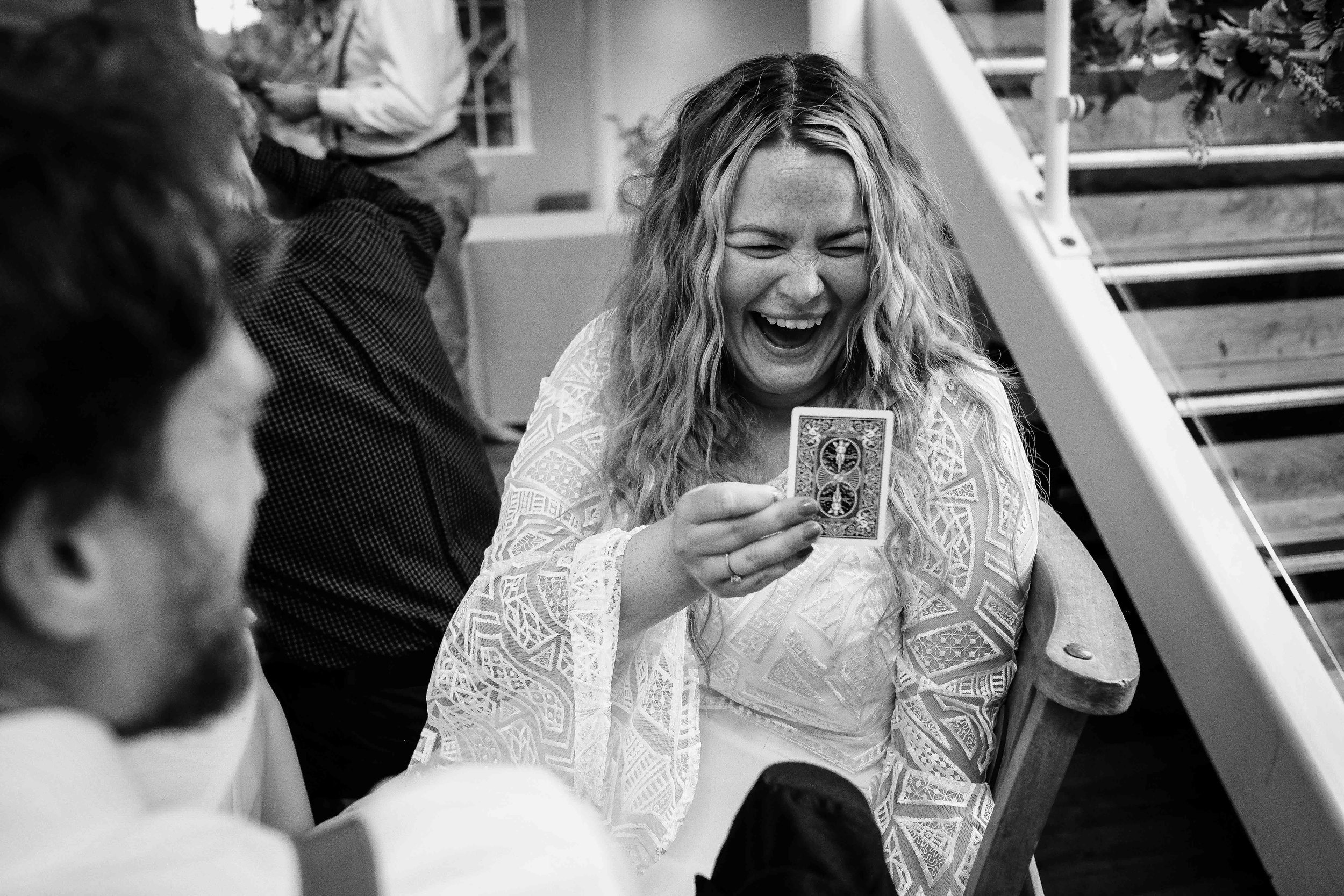 Wedding magician performing for bride.