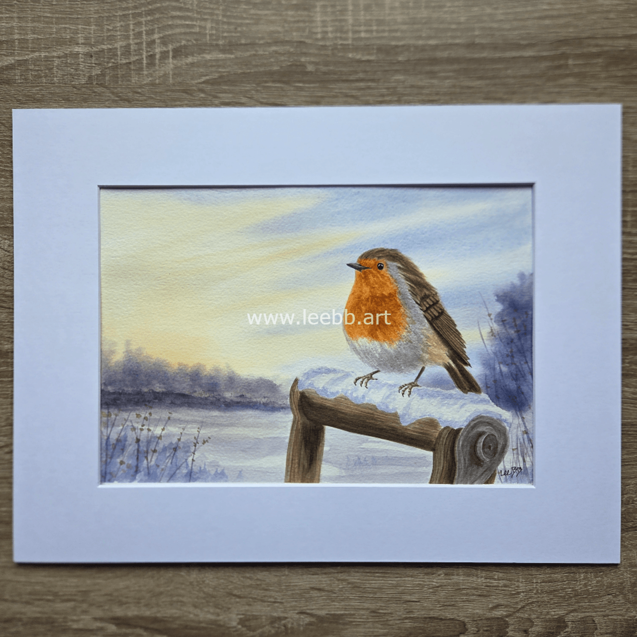 Original watercolour painting Winter Perch featuring a robin perched in a traditional snowy winter scene
