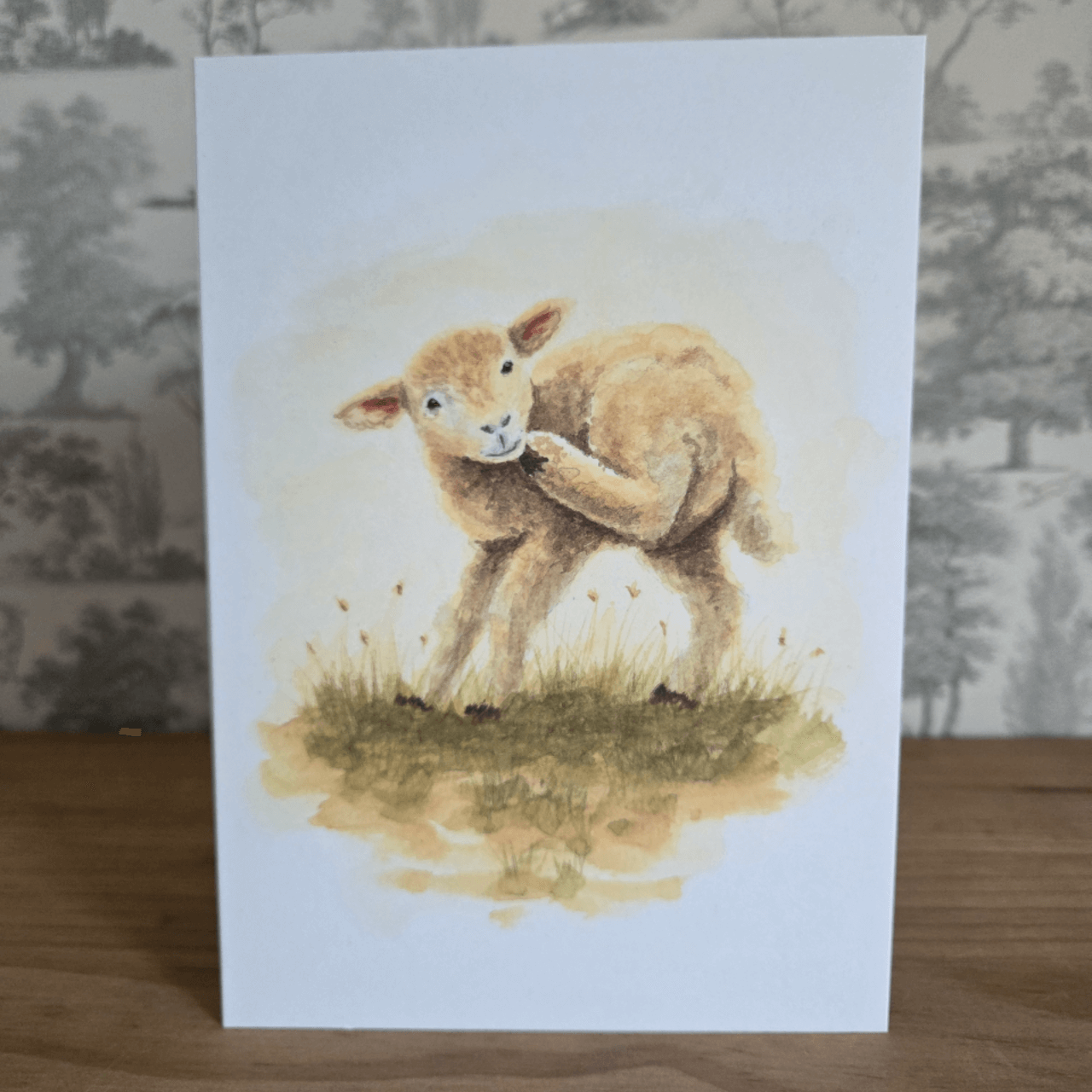 Spring greeting card featuring lamb illustration.