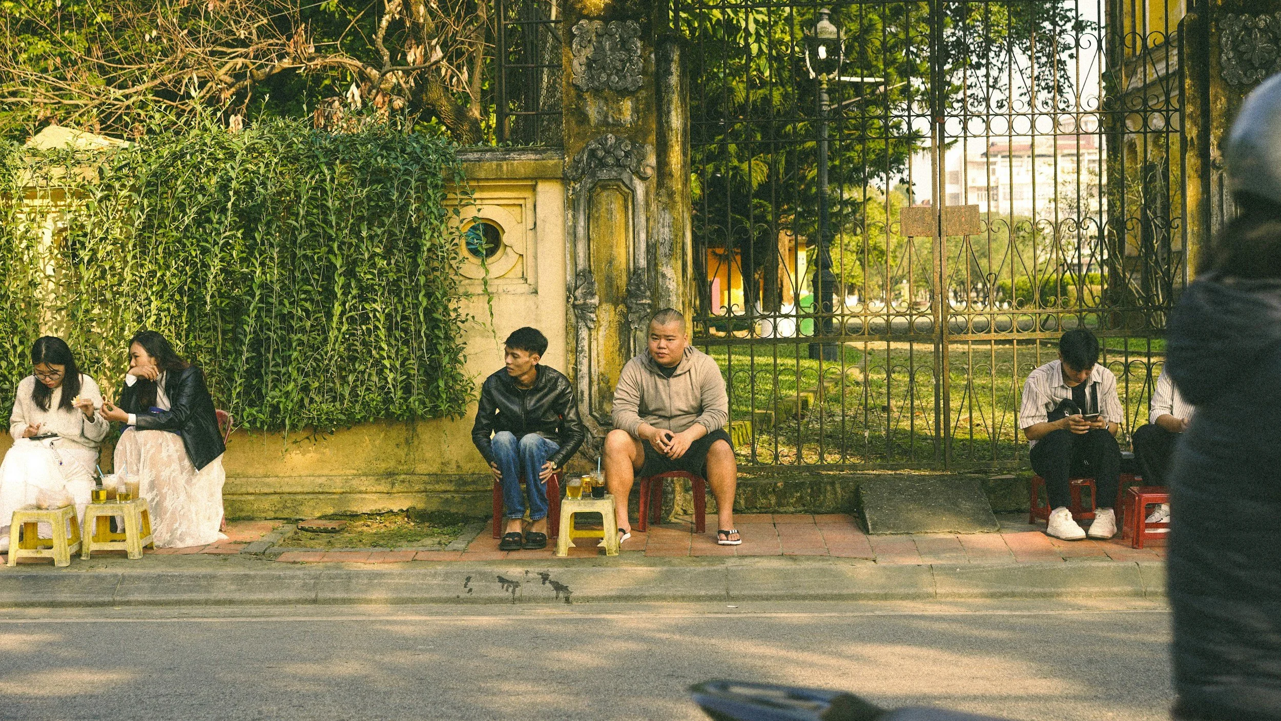 Sitting in comfortable silence, two young men, no eye contact but sat with each other