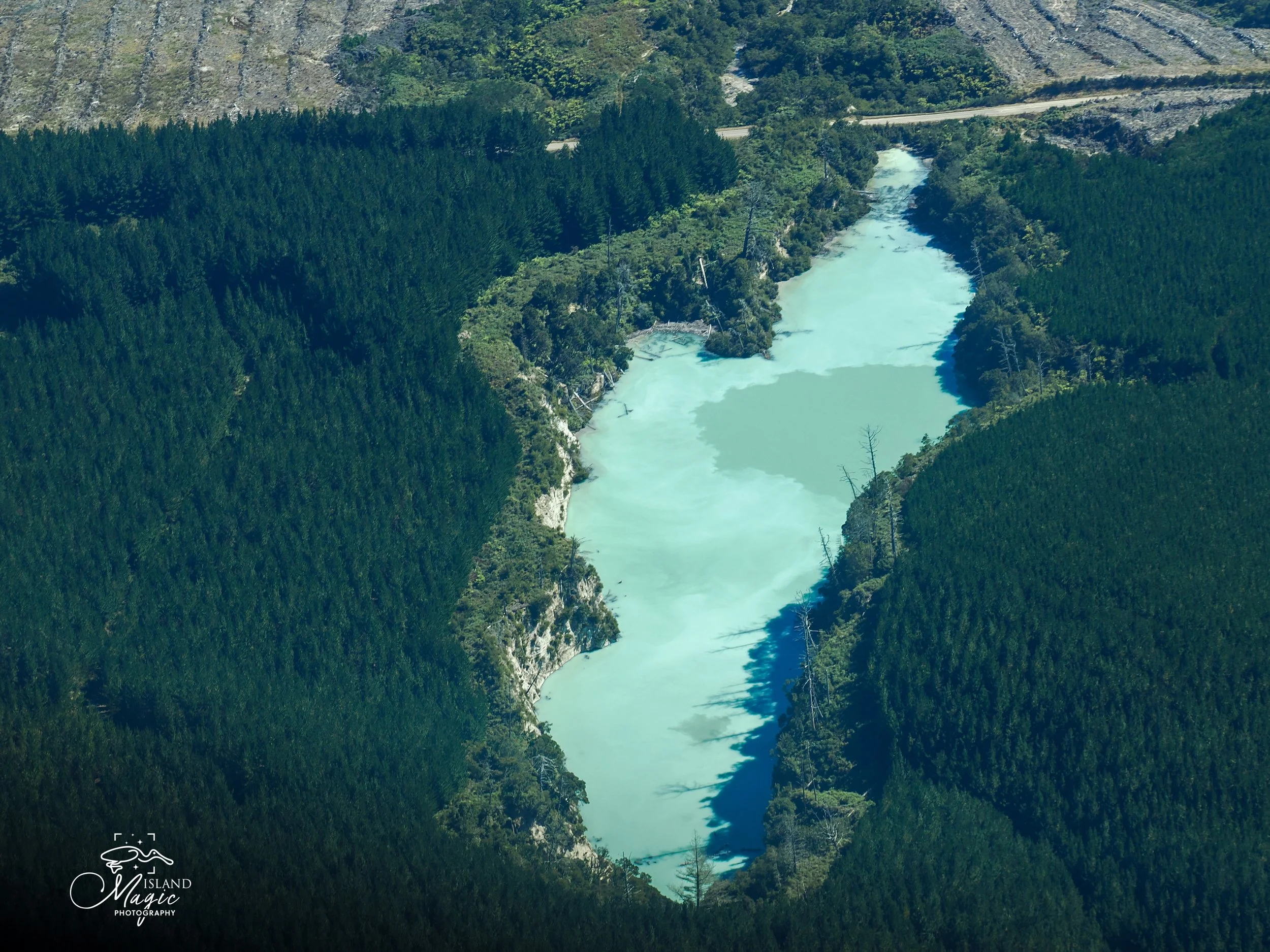 Lots of blue water spots and "lakes" sometimes connected by underground rivers. The blue comes from: A geothermal outflow channel
fed by:

Hot springs
Silica terraces
Subsurface hydrothermal vents

As the water cools:

Dissolved silica forms tiny par