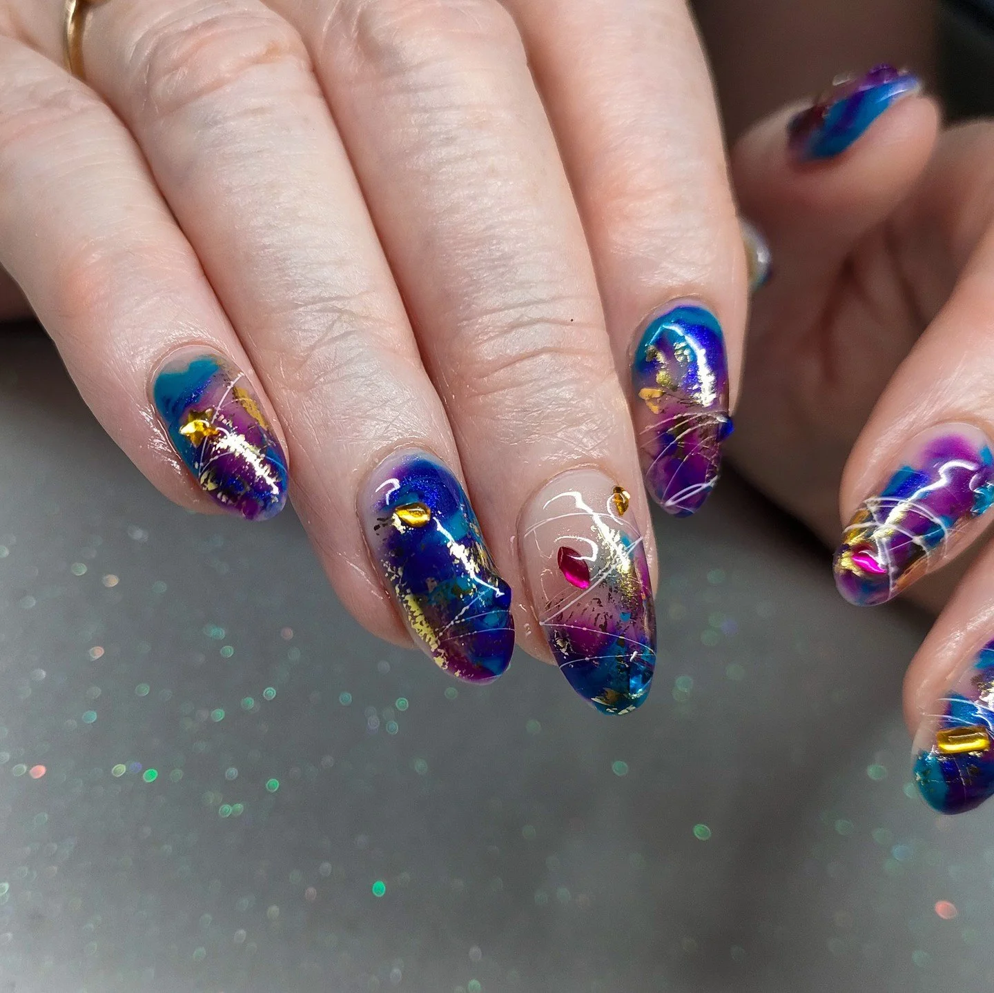 juicy jewel tones for my mama 🥹⁠
⁠
🧜🏼&zwj;♀️⁠
.⁠
.⁠
.⁠
Using @designer_nails_distribution 🔥⁠
If you want to give them a go for your clients, use SERENA5 at checkout for a discount x (professional only)⁠
.⁠
.⁠
.⁠
#shortnails #mermaidnails #rhinest