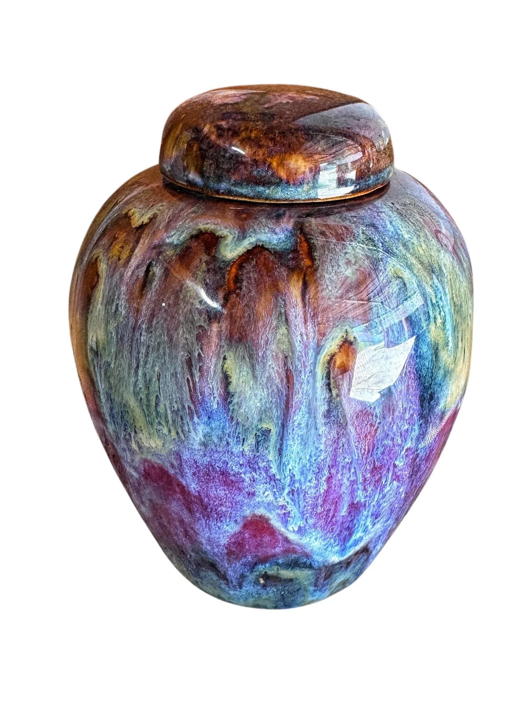 A colorful, abstract ceramic urn with a rounded top and a swirling pattern of reds, blues, purples, and greens made by Tara Hinkley from Creative Lotus Shop