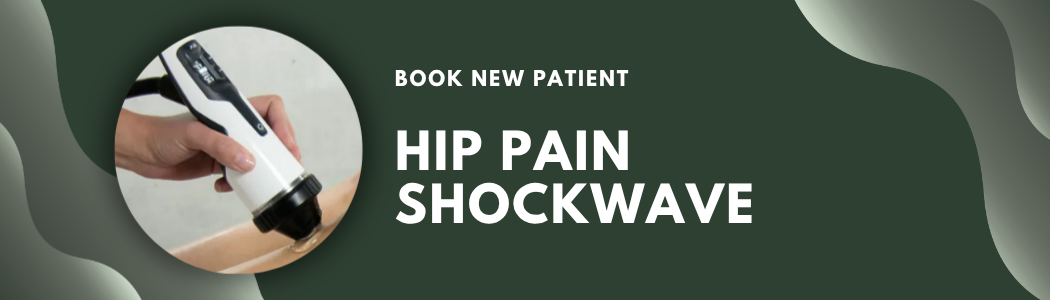 A person undergoing a hip pain shockwave therapy session, holding a handheld device against their hip.