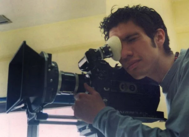 Person looking through a telescope or monocular device.