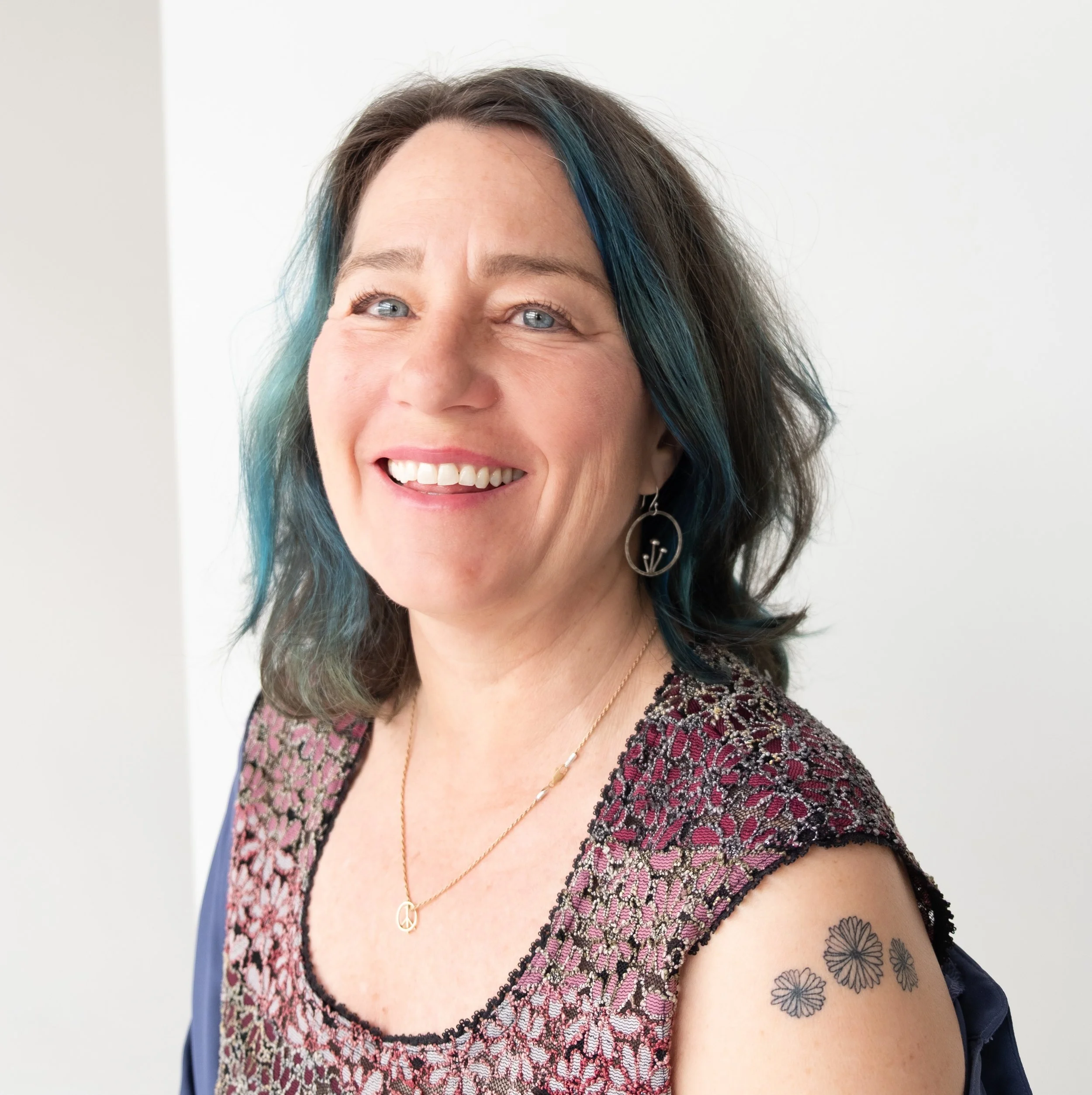 Photo of Pam Peters looking at the camera and smiling.