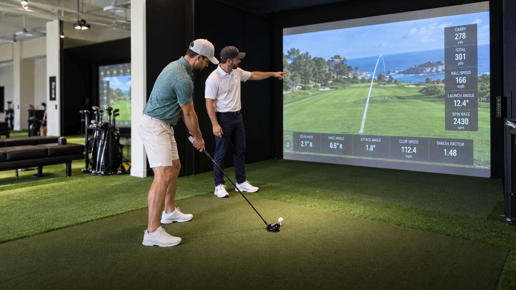 A Coastal Golf Academy coach gives one-to-one swing feedback to a golfer in a Foresight simulator bay