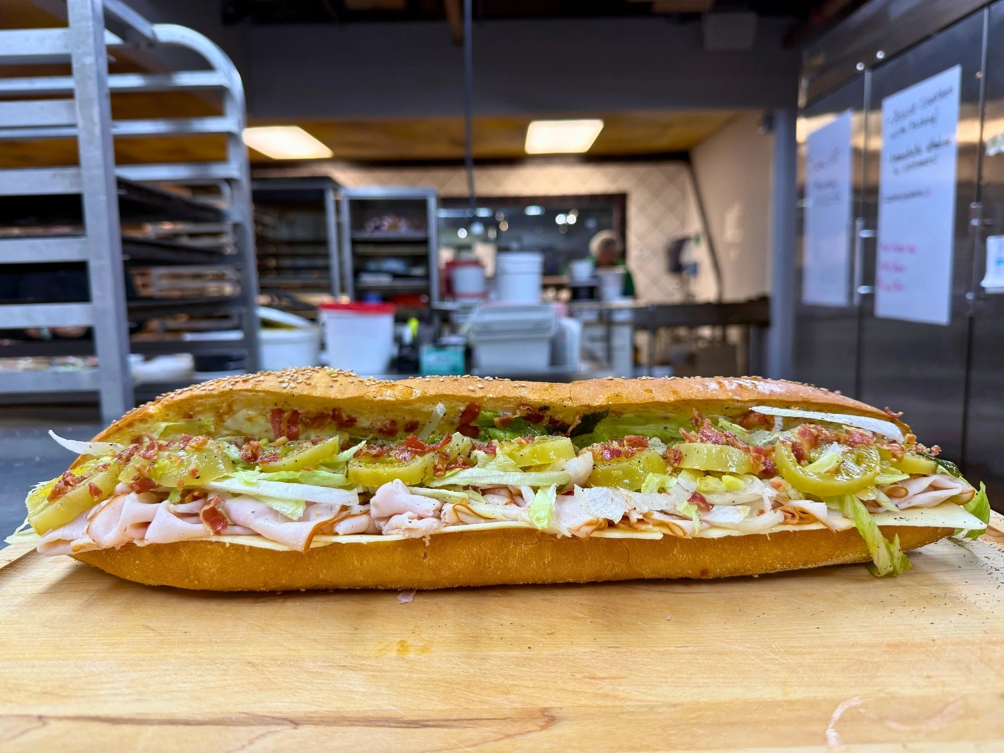 🚨SANDWICH SATURDAY🚨
Available Saturday, September 13th ONLY!
✨Il Verde Sottaceto✨
An artisanal semolina baguette, stacked with roasted turkey, creamy mayo, and our house-grown & house-pickled green tomatoes. Layered with sharp white cheddar,
