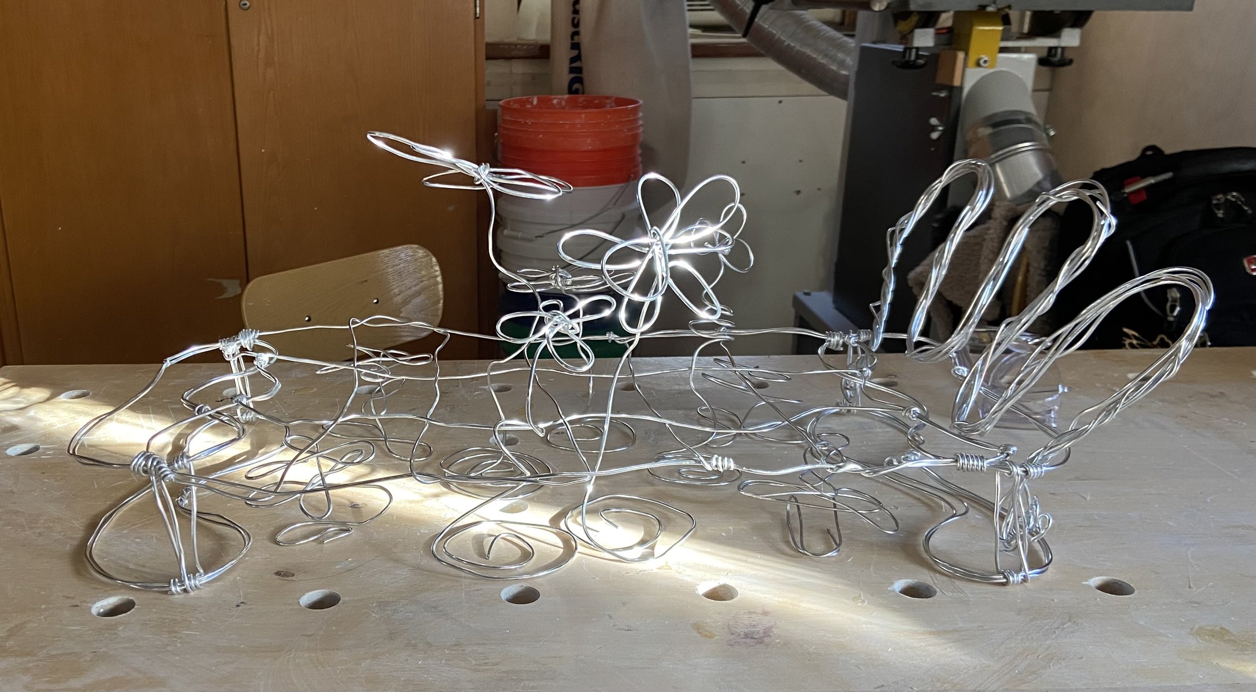 The illustration is based off a wire sculpture I made in a Sculpture class. Because I loved the concept of a flower bed so much, I decided to "immortalize" the Flower Bed by turning it into an illustration.