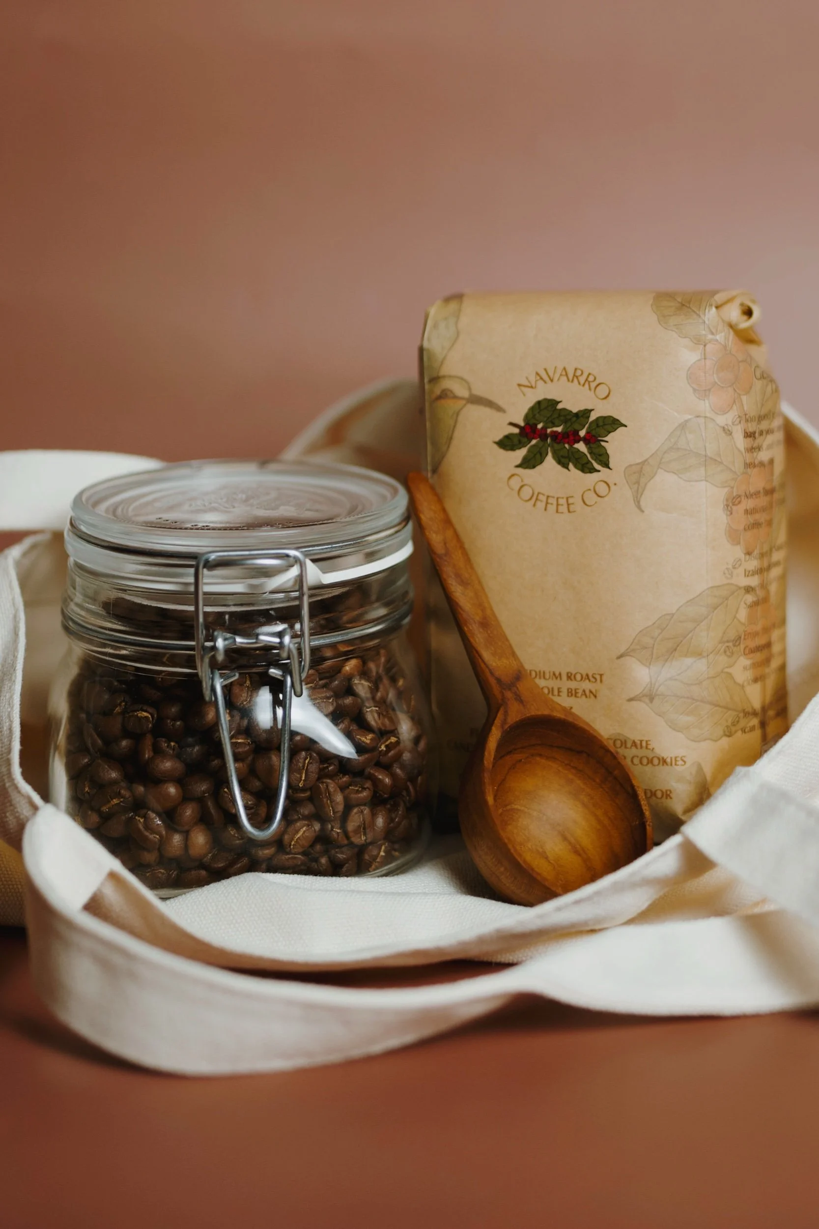 Navarro Coffee Co El Salvador whole bean coffee bag, bottled cold brew, organic tote bag.