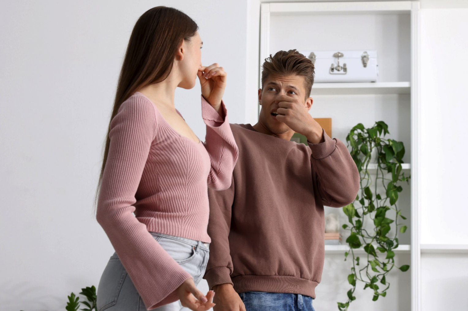 man and woman in house that smells musty