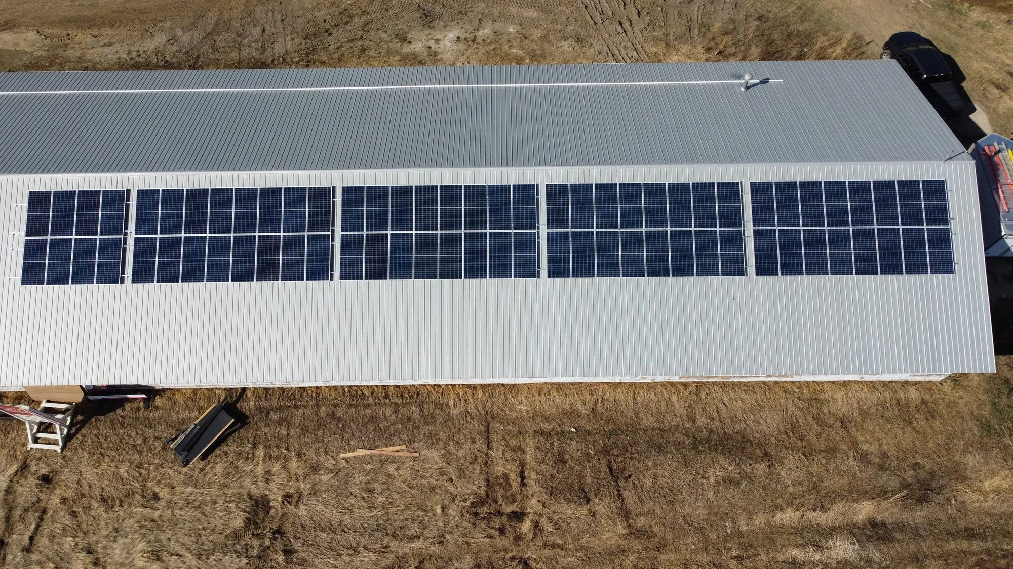 Solar panels on a metal barn roof on a farm in Leduc County, Alberta, installed by Greenamp