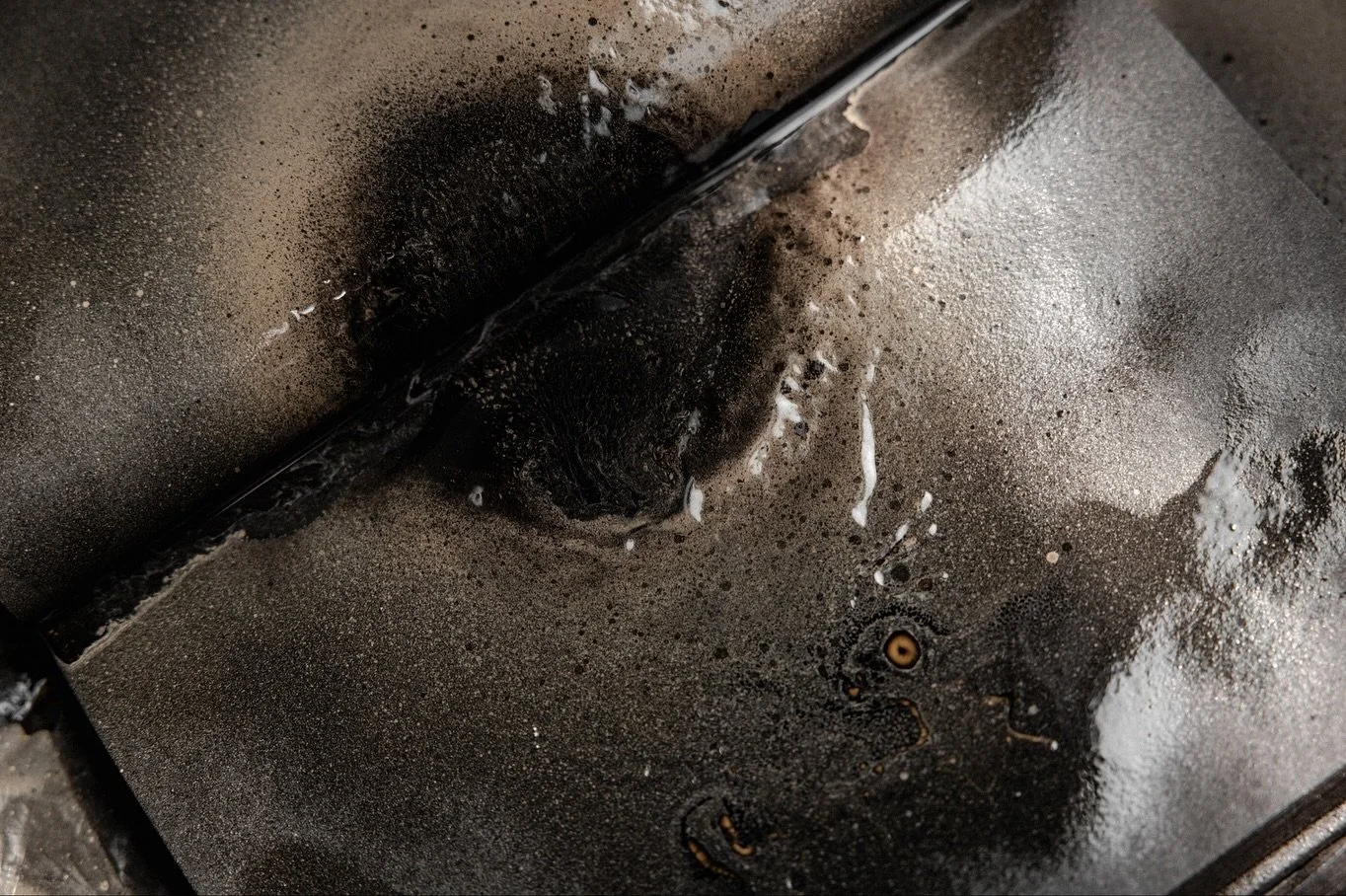 STUDY OF HEAT &mdash; BOOK OF BLACK HOLES. Layers of spray on paper.