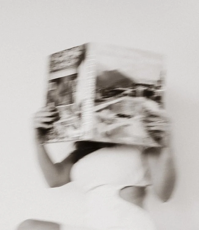 Designer holding coffee table book.jpg