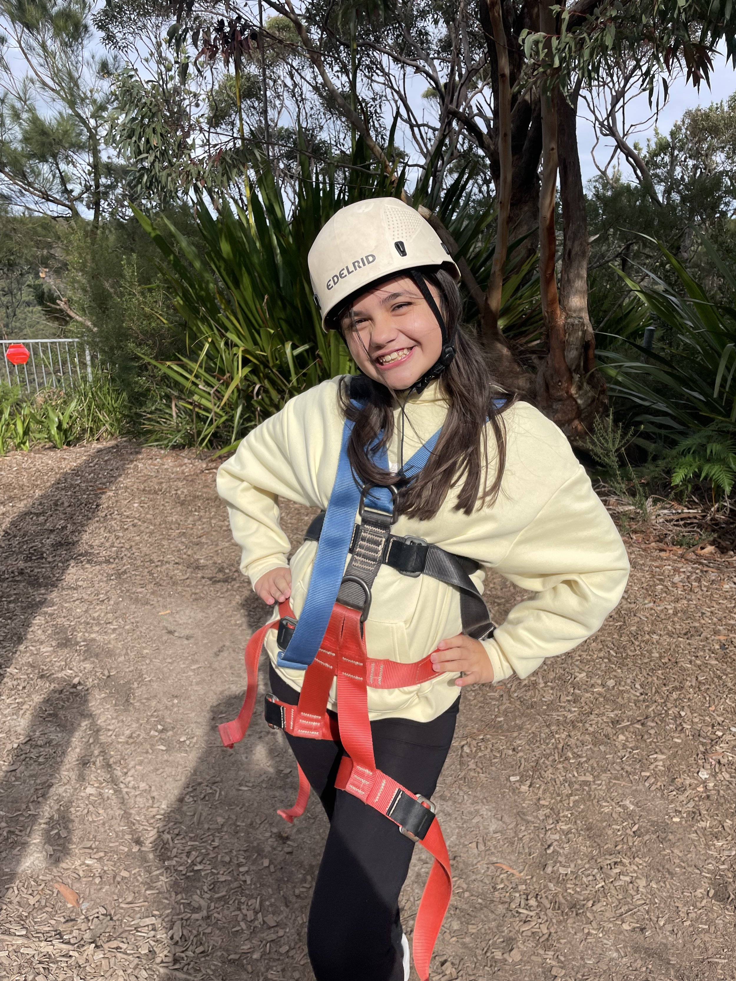 Student smiling with harness.jpeg