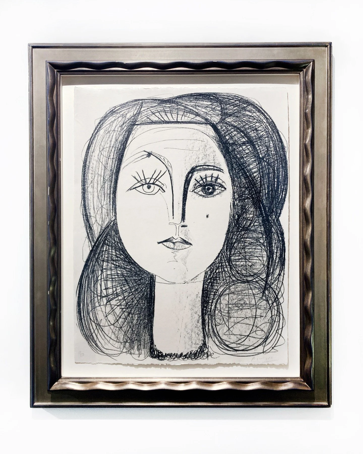 Pablo Picasso's muse and partner, Françoise Gilot, stares boldly into our #Boston gallery 💫 in honor of this iconic modern master's birthday, we are lucky to get to show off this lithograph, edition 5/50, signed by the artist himself. Celebra