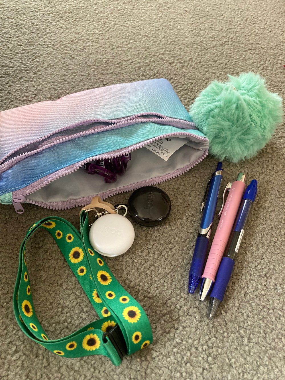 Pencil case with fidgets, earplugs and pens