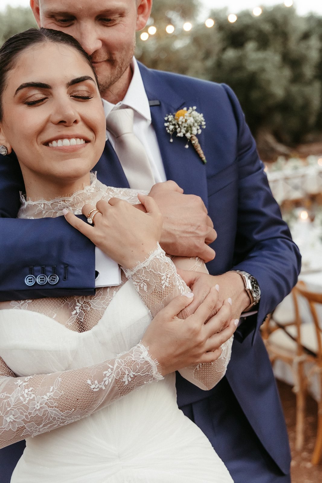 Paul hugging Valentina from behind as they laugh