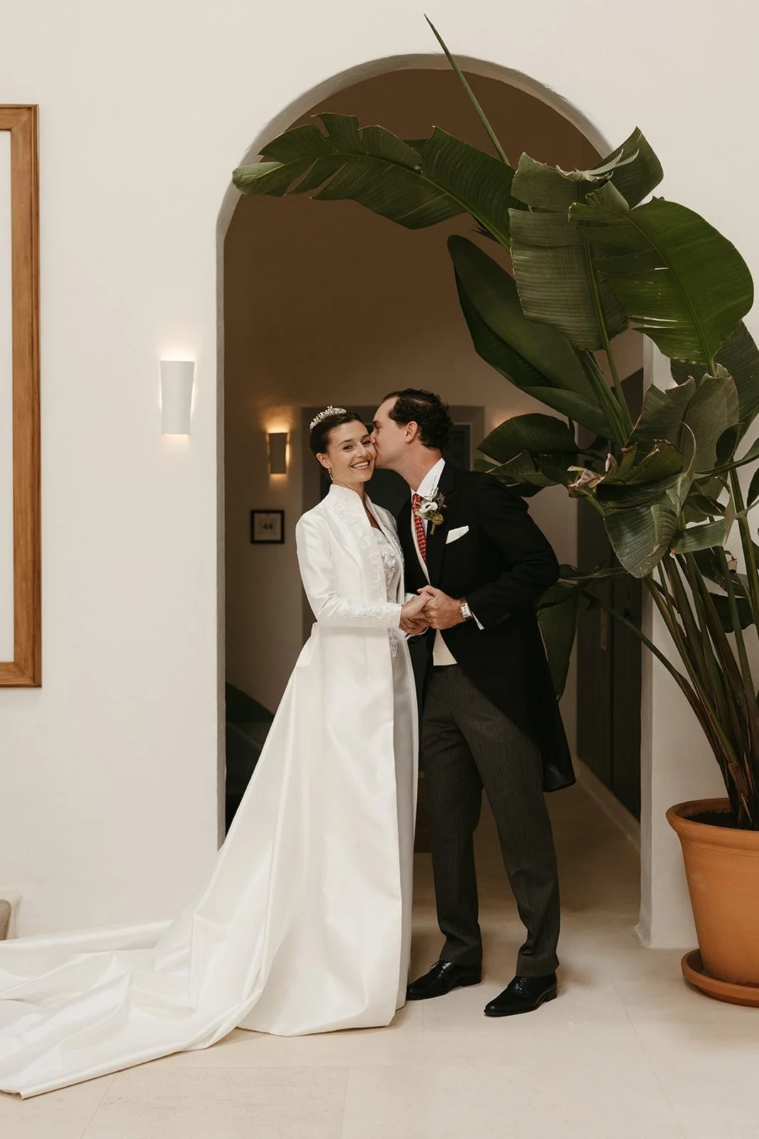 Bride and groom kissing at their first look in Ciutadella, Menorca