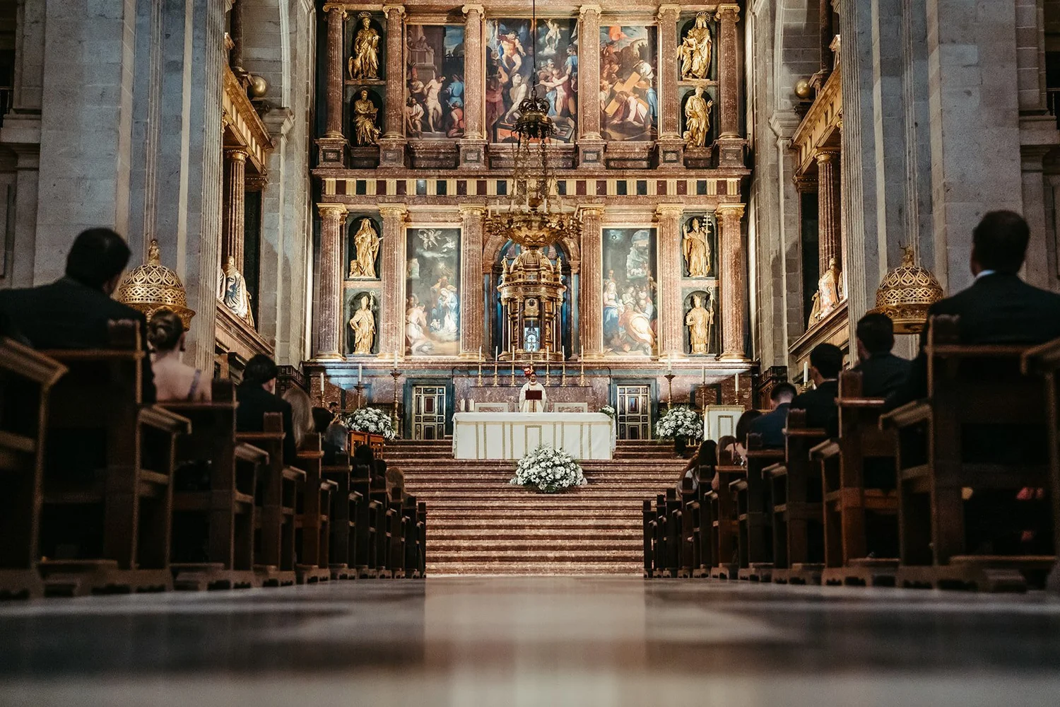 Wedding ceremony in front of the main altarpiece of the Basilica of El Escorial, Madrid