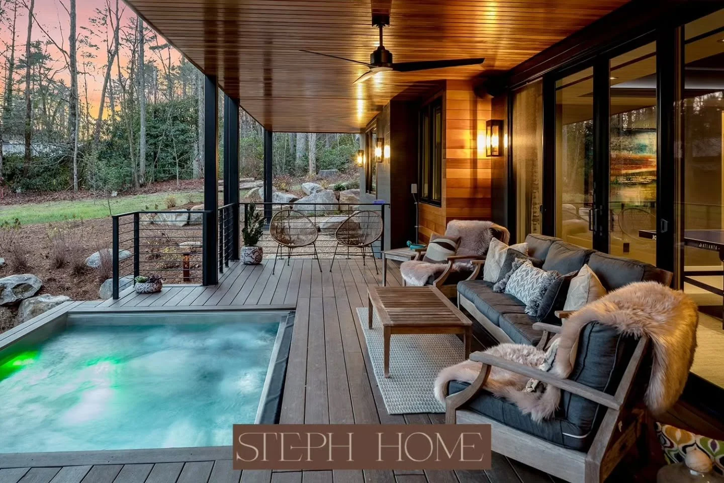 There's a specific kind of light that only shows up as summer starts letting go. Golden, low, a little more orange than it was in July. This porch was designed with exactly that light in mind.

A huge spa right off the deck. Cable railing that stays 