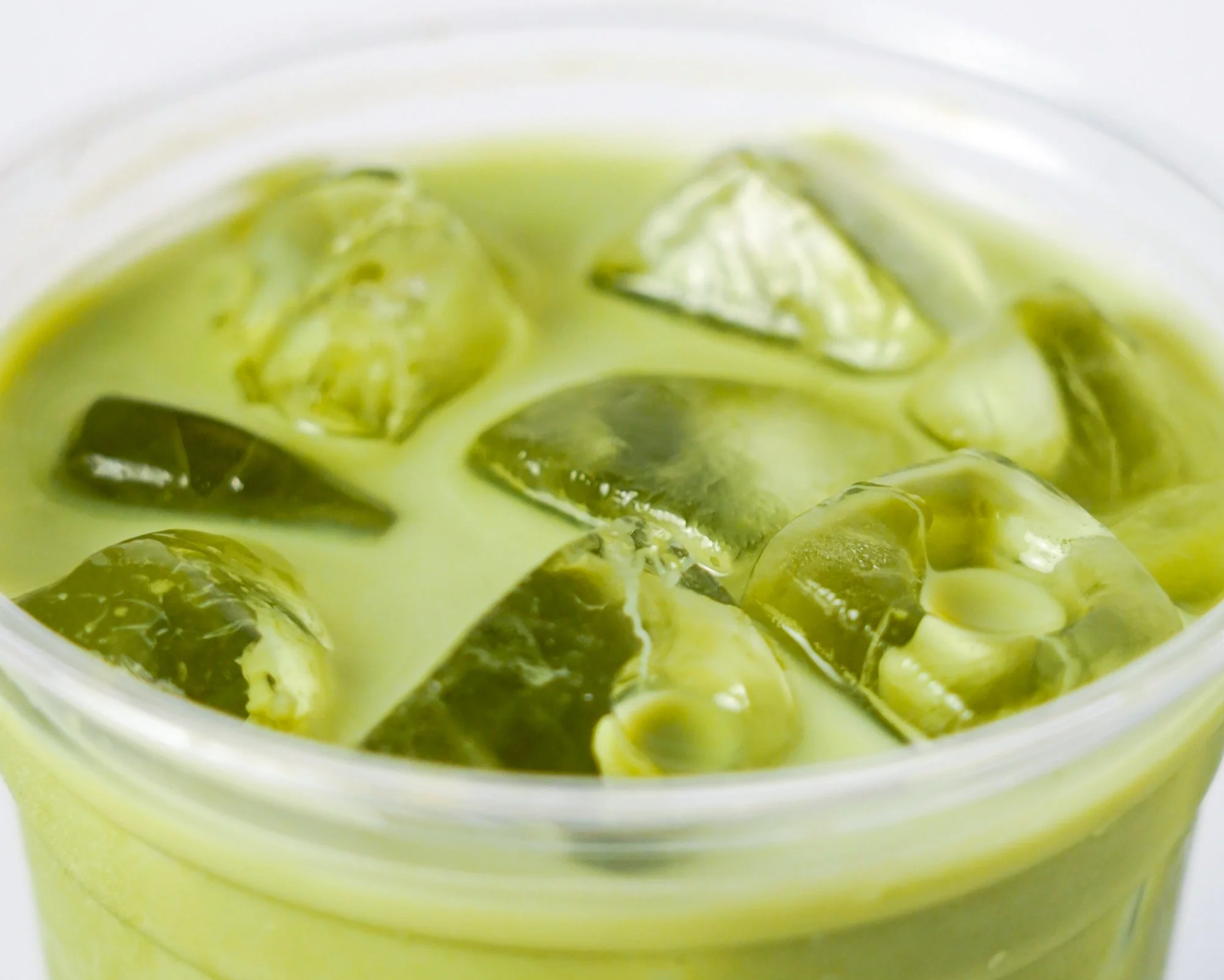A refreshing iced matcha drink in a Coffee House cup