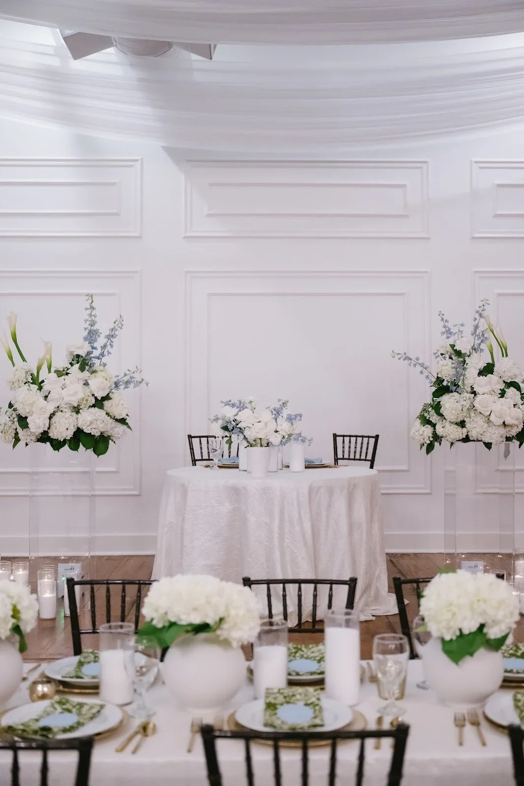 Wedding sweetheart table with white floral arrangements