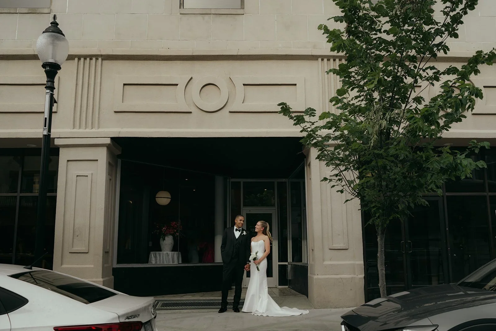 Bride and groom stand outside coastal NC wedding venue The Elia