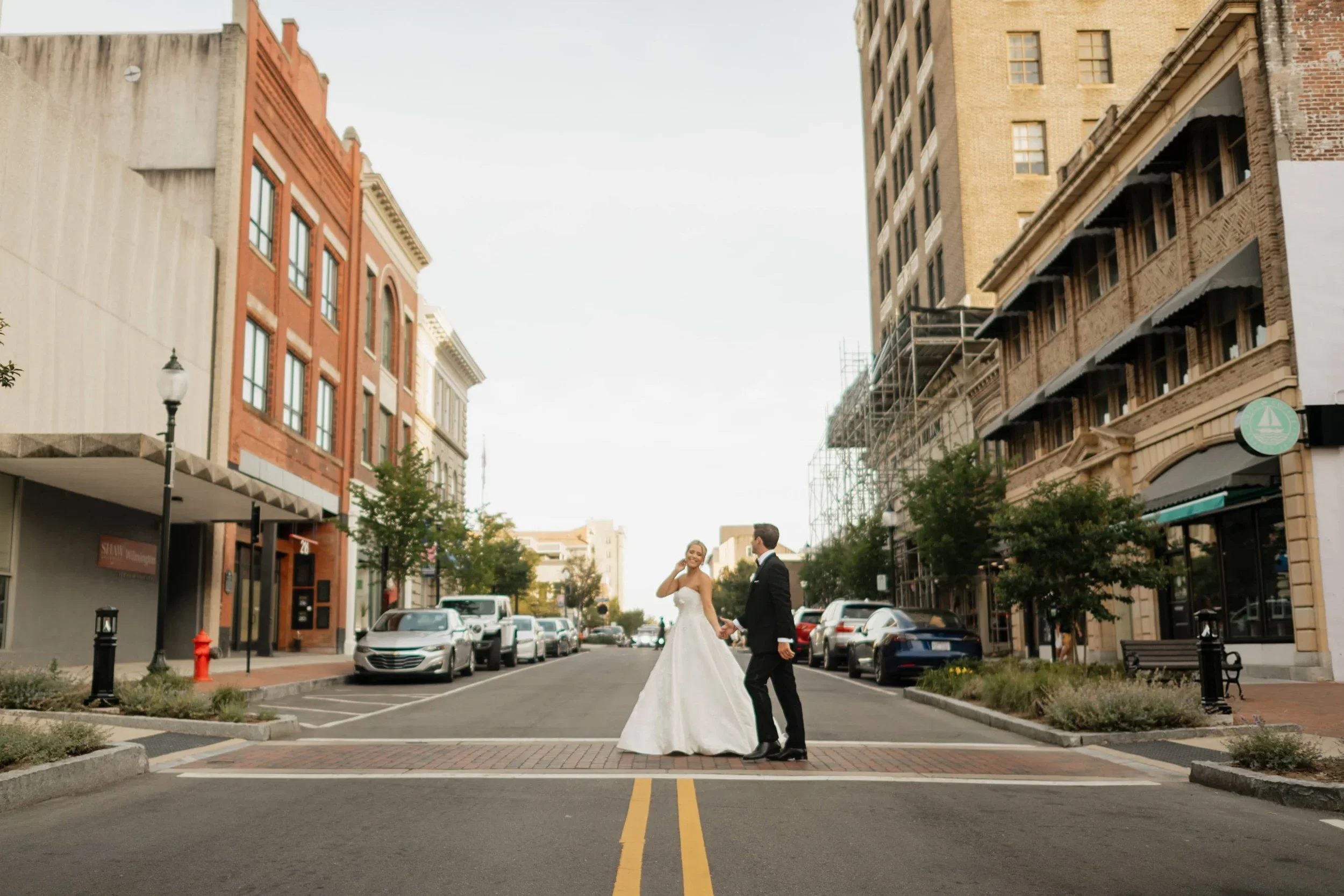 Newlyweds cross street in Wilmington North Carolina