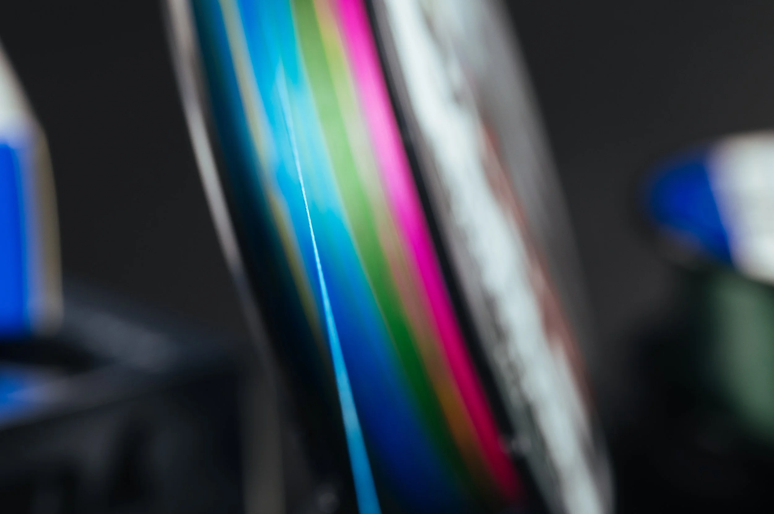 Blurred close-up of a computer or phone screen displaying colorful lines and shapes.