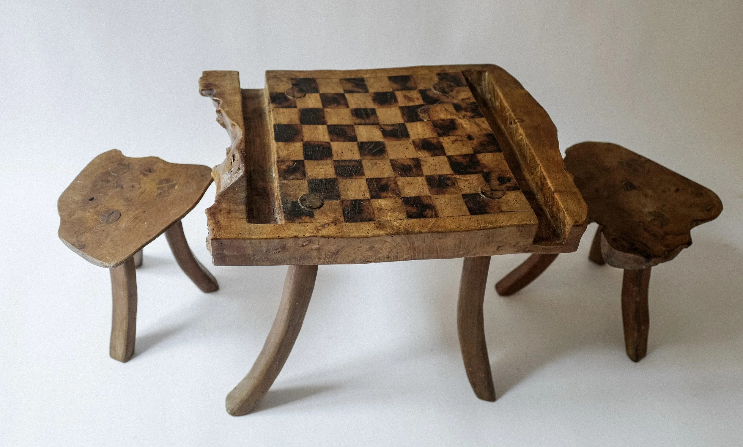 A low primitive Chess table set with stools