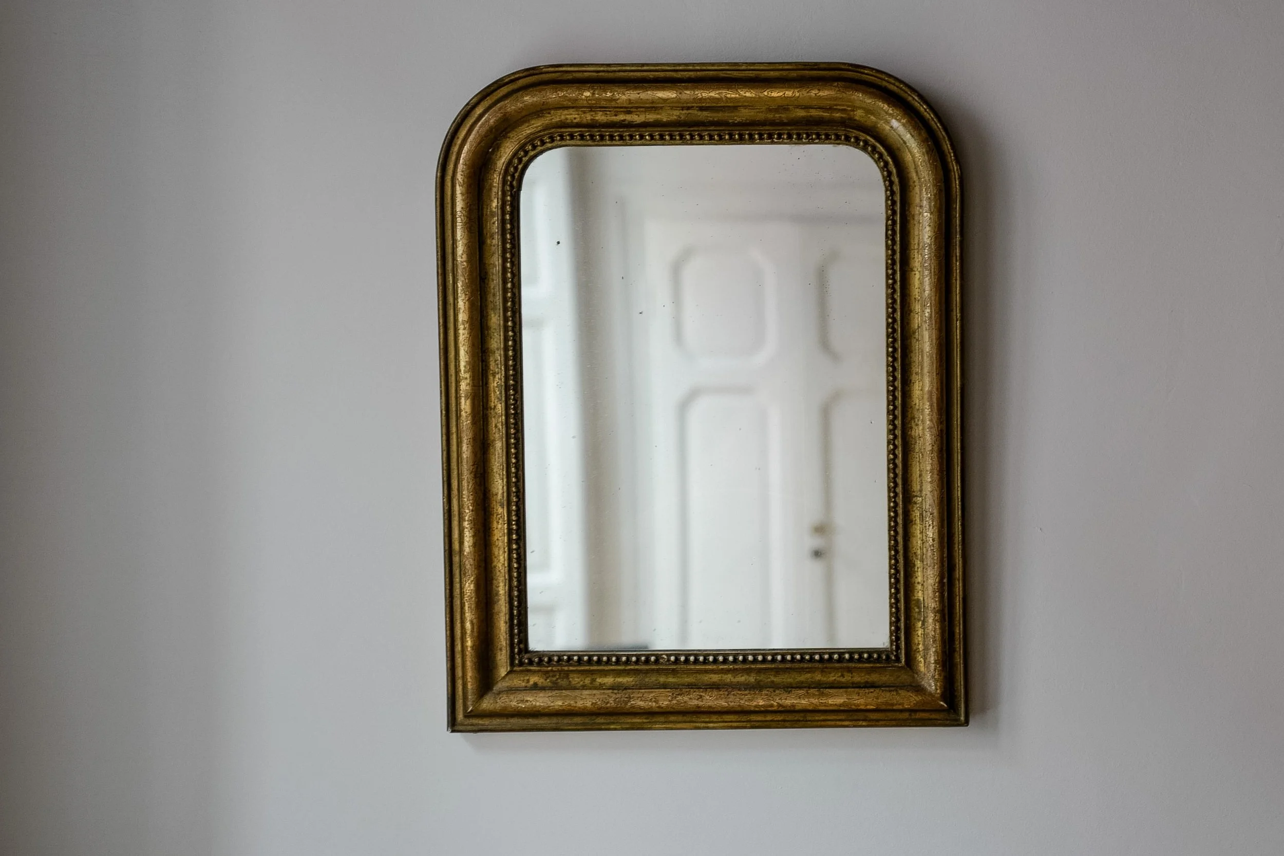 Antique Louis Philippe beaded mirror in gold