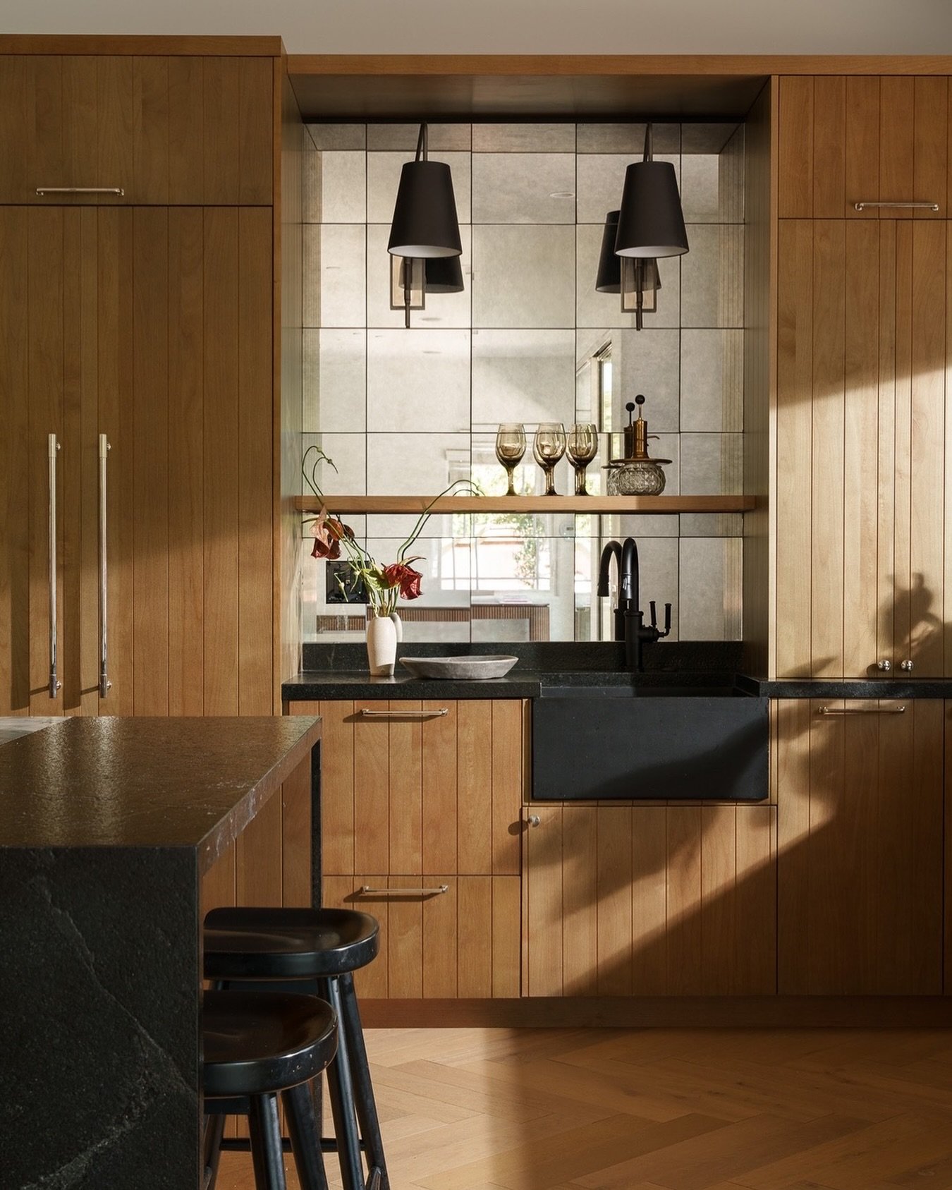 Throwing it back to this moody, material-rich kitchen we wrapped last year for a lovely client&mdash;think warm wood, layered textures, and quiet sophistication. ✨ 
⠀⠀⠀⠀⠀⠀⠀⠀⠀
Now we&rsquo;re upstairs, working on their master bath, with a secret entry