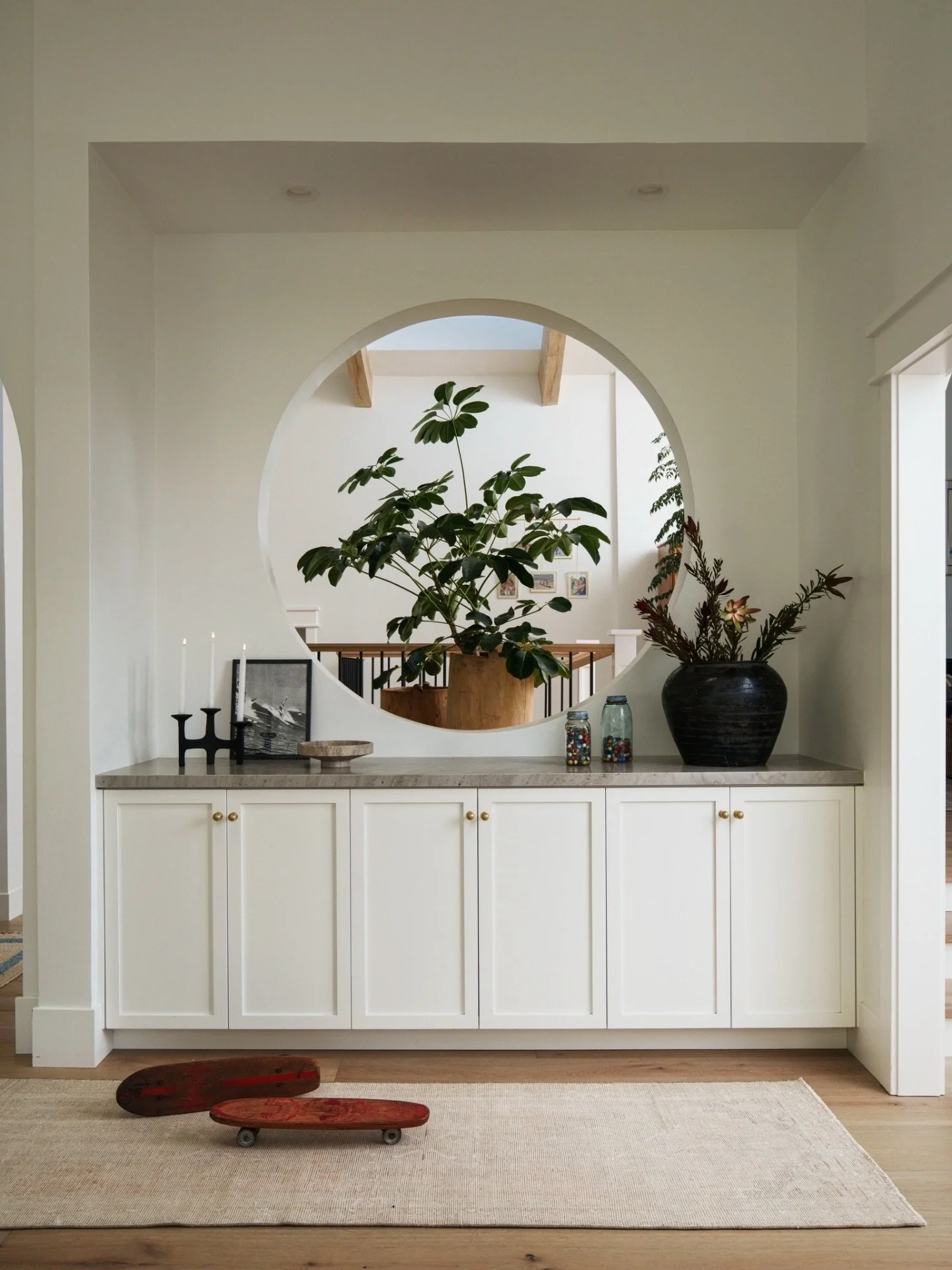 Fun fact: this 1970s home was supposed to have a mirror here &mdash; but the builder read the architect&rsquo;s plans literally and framed it as a cut out instead. Best mistake ever. Now the Entry connects to the Family Room and the light pours strai