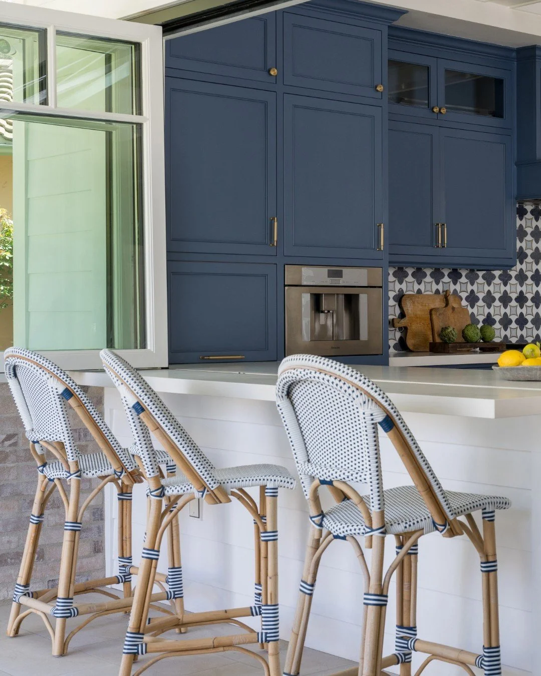 Deep blue, warm wood, graphic tile, woven texture &mdash; coastal with intention.

Summer energy still very much intact.