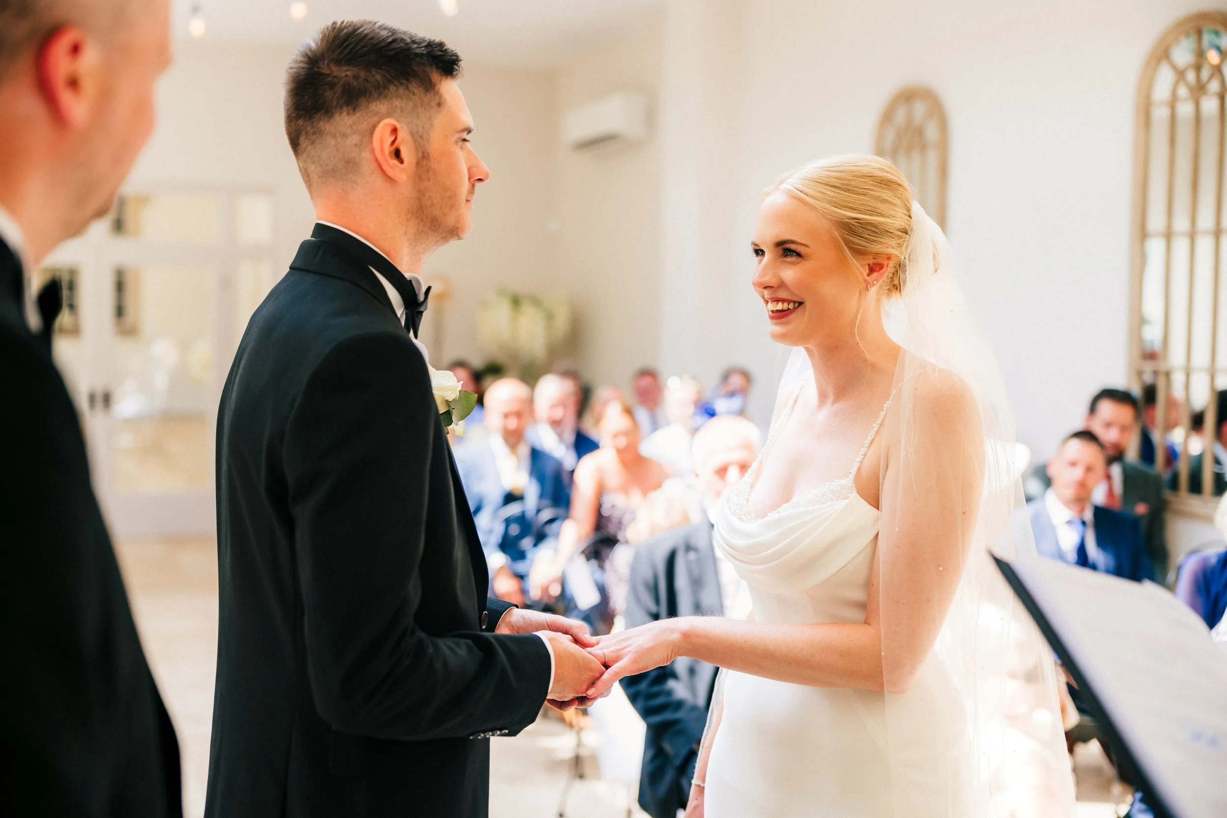 WOODBOROUGH HALL WEDDING PHOTOGRAPHER - bride and groom exchange rings during their wedding ceremony