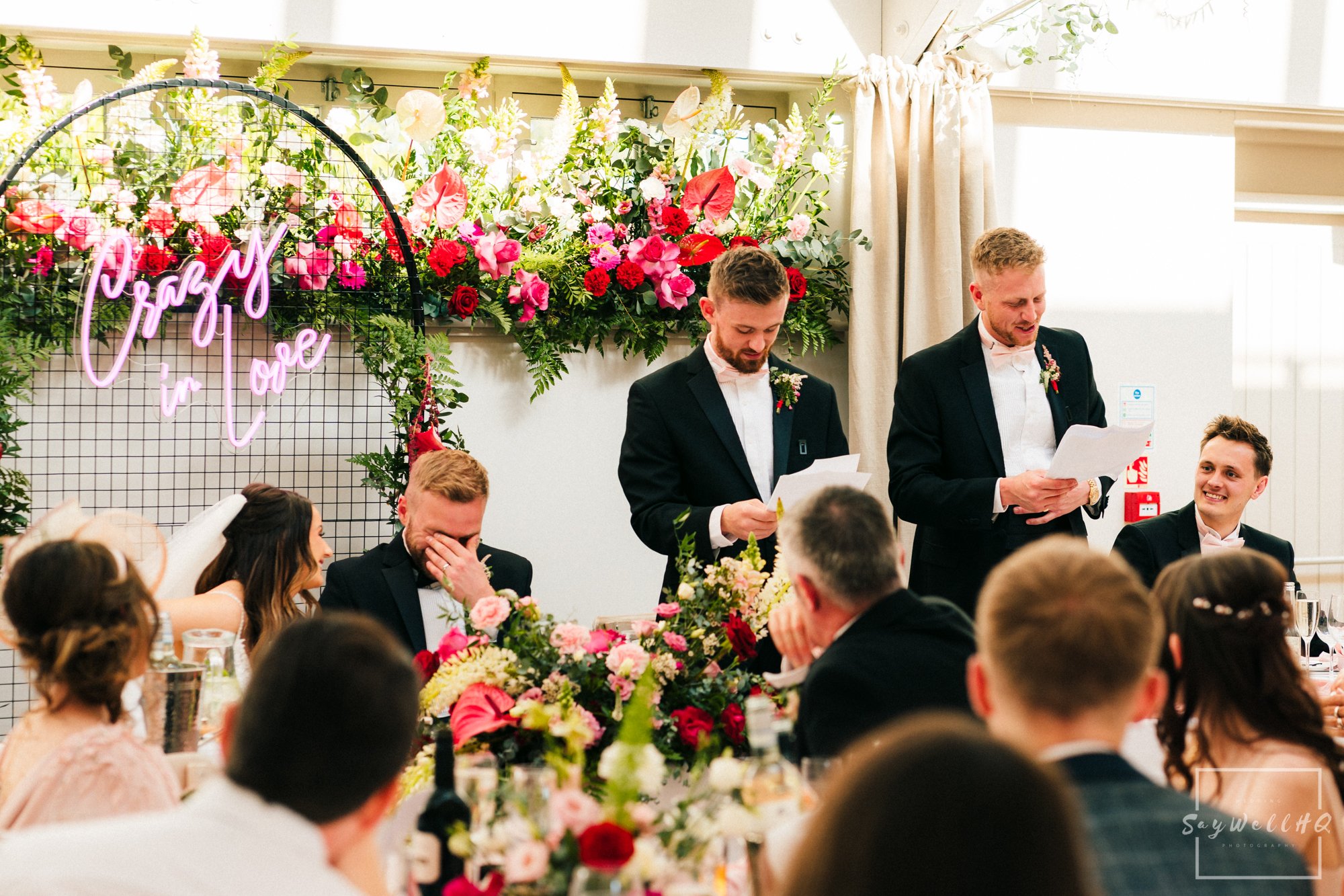 Groom hides his face during the best mans speech