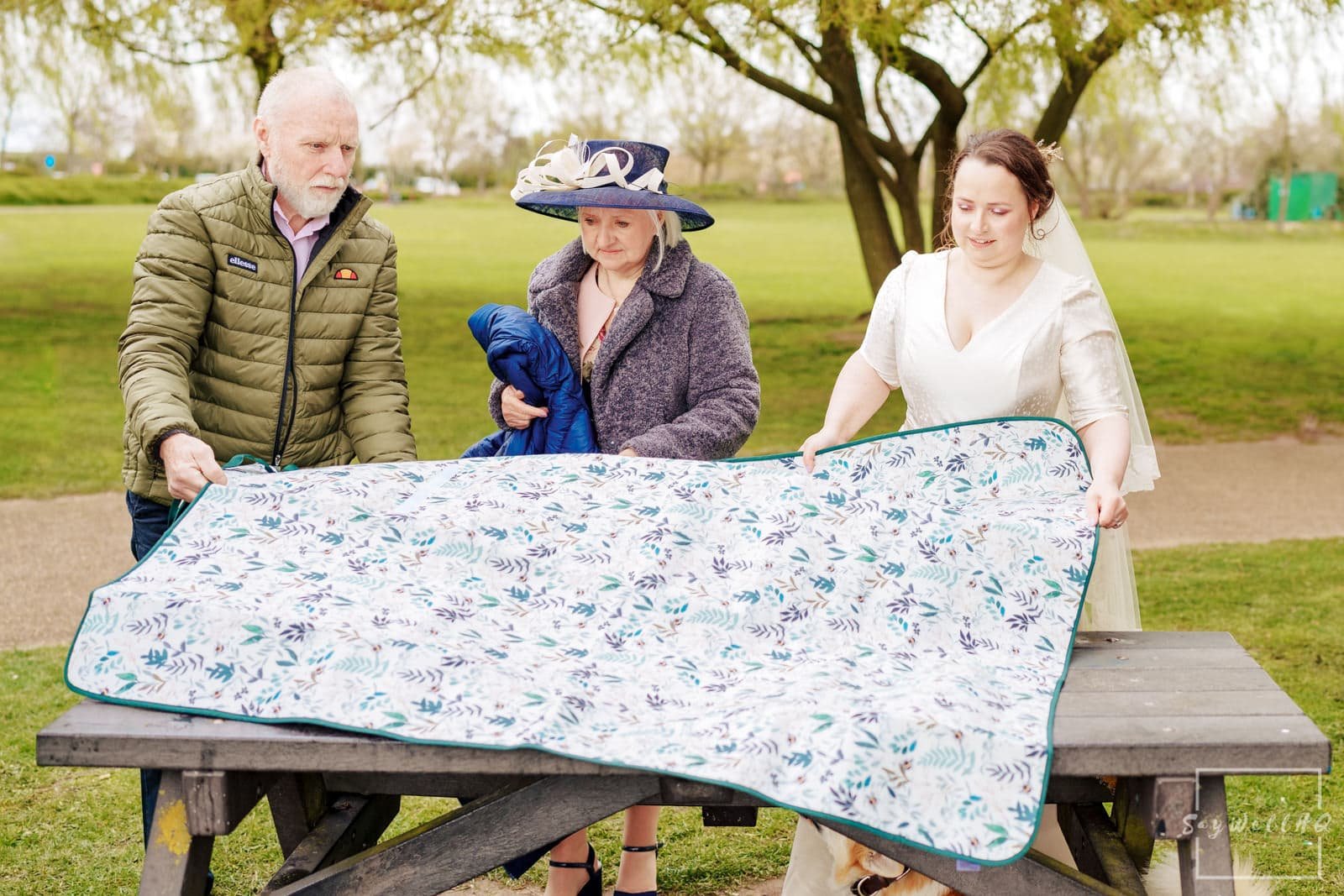 Newark Wedding Photography + Newark Wedding Photographer + bride and groom celebrate with their wedding guests with a picnic by the side of the river trent