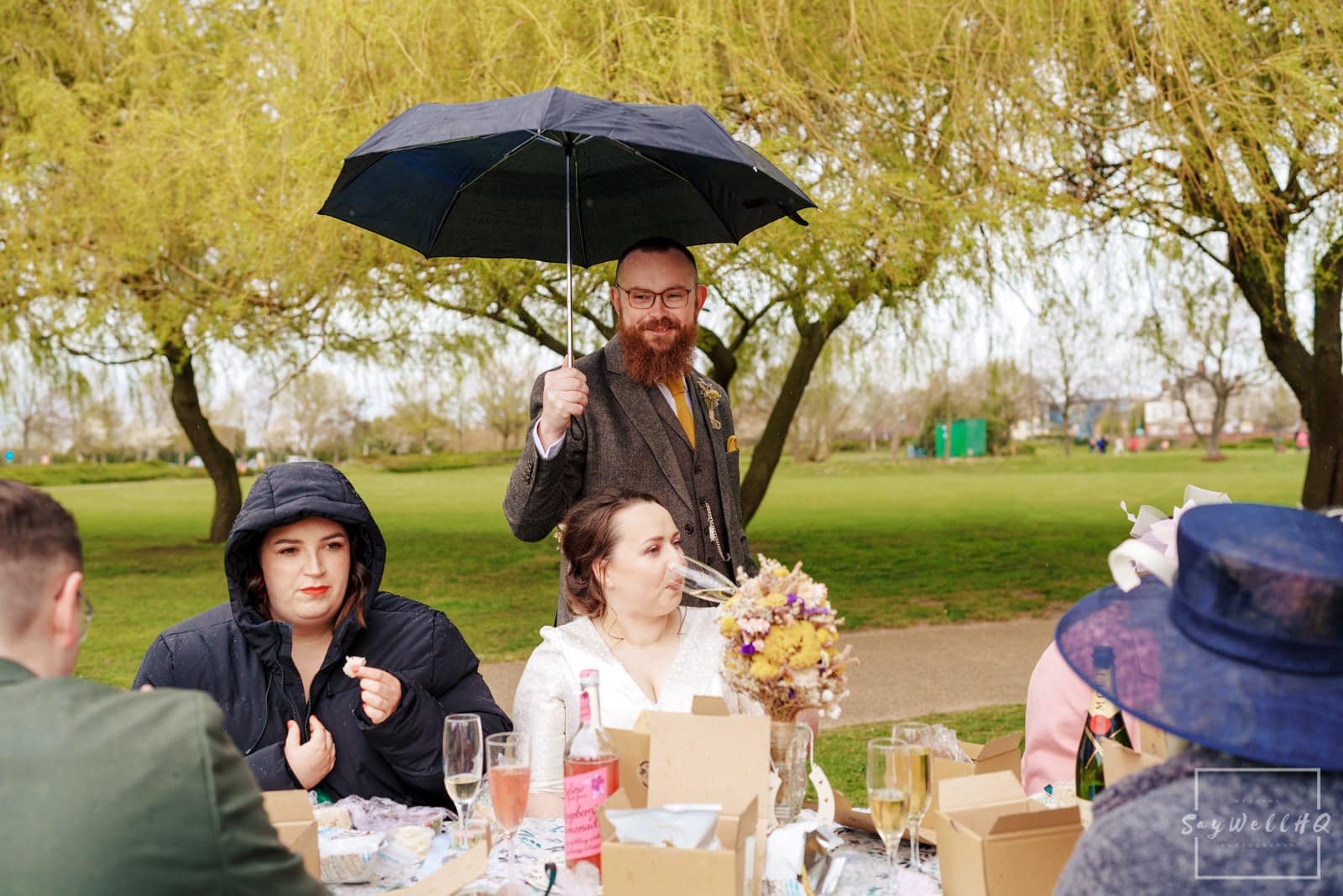 Newark Wedding Photography + Newark Wedding Photographer + bride and groom celebrate with their wedding guests with a picnic by the side of the river trent