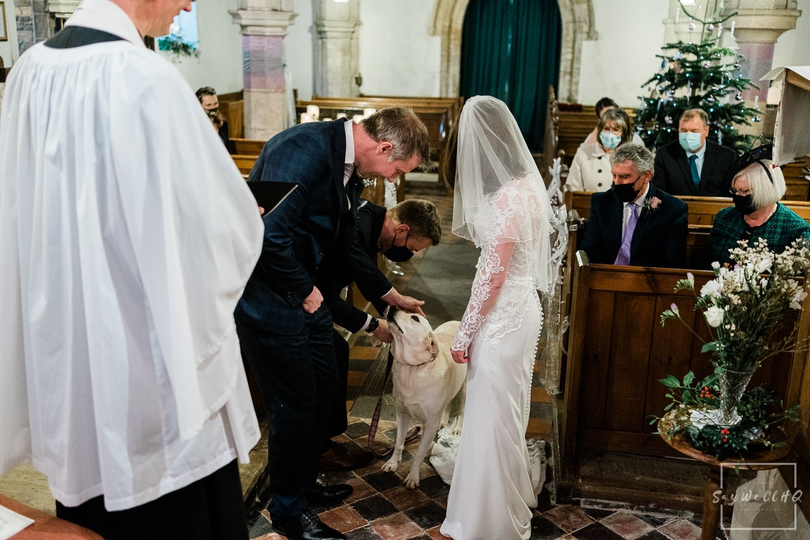 Vale of Belvoir Wedding Photography - dog ring bearer delivering the wedding rings to the bride and groom
