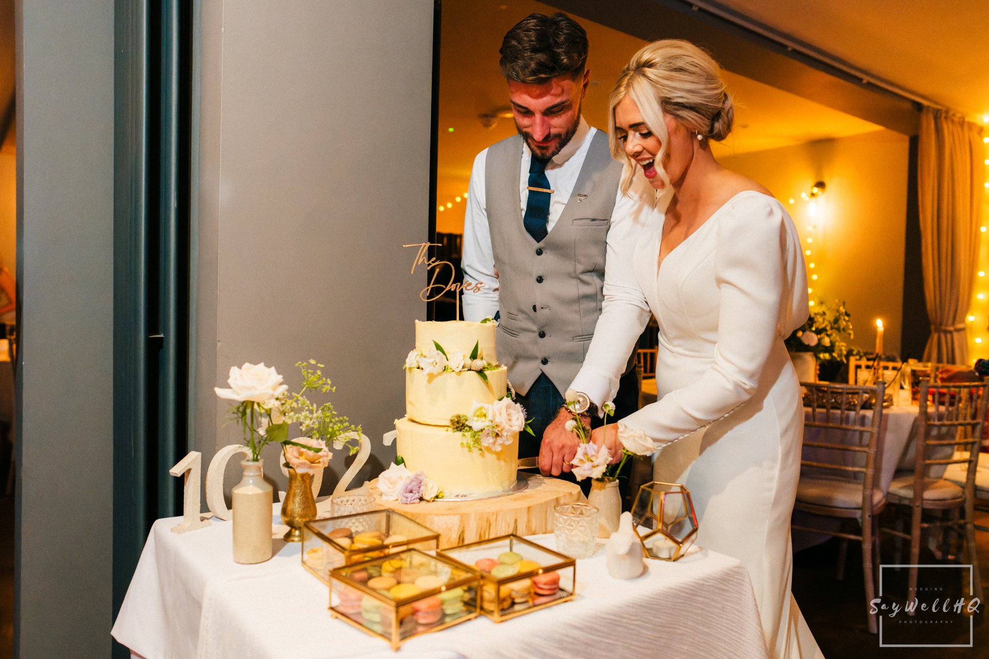 Bride and groom cutting their wedding cake at their Chequers Inn Wedding