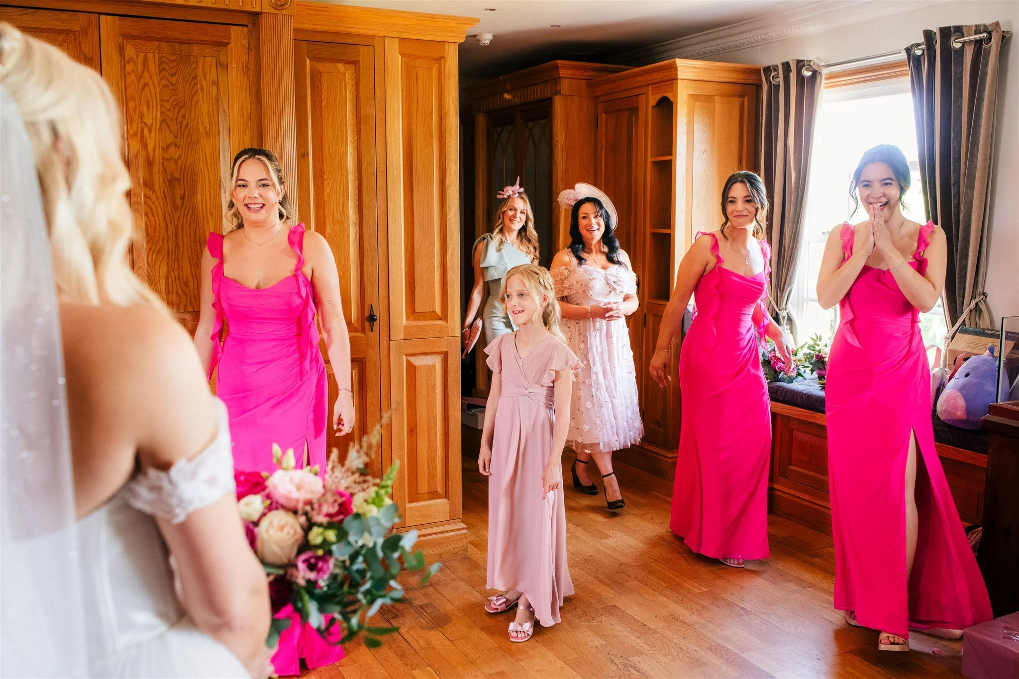 The bridesmaids reaction to seeing the bride in her wedding dress on the morning of her wedding