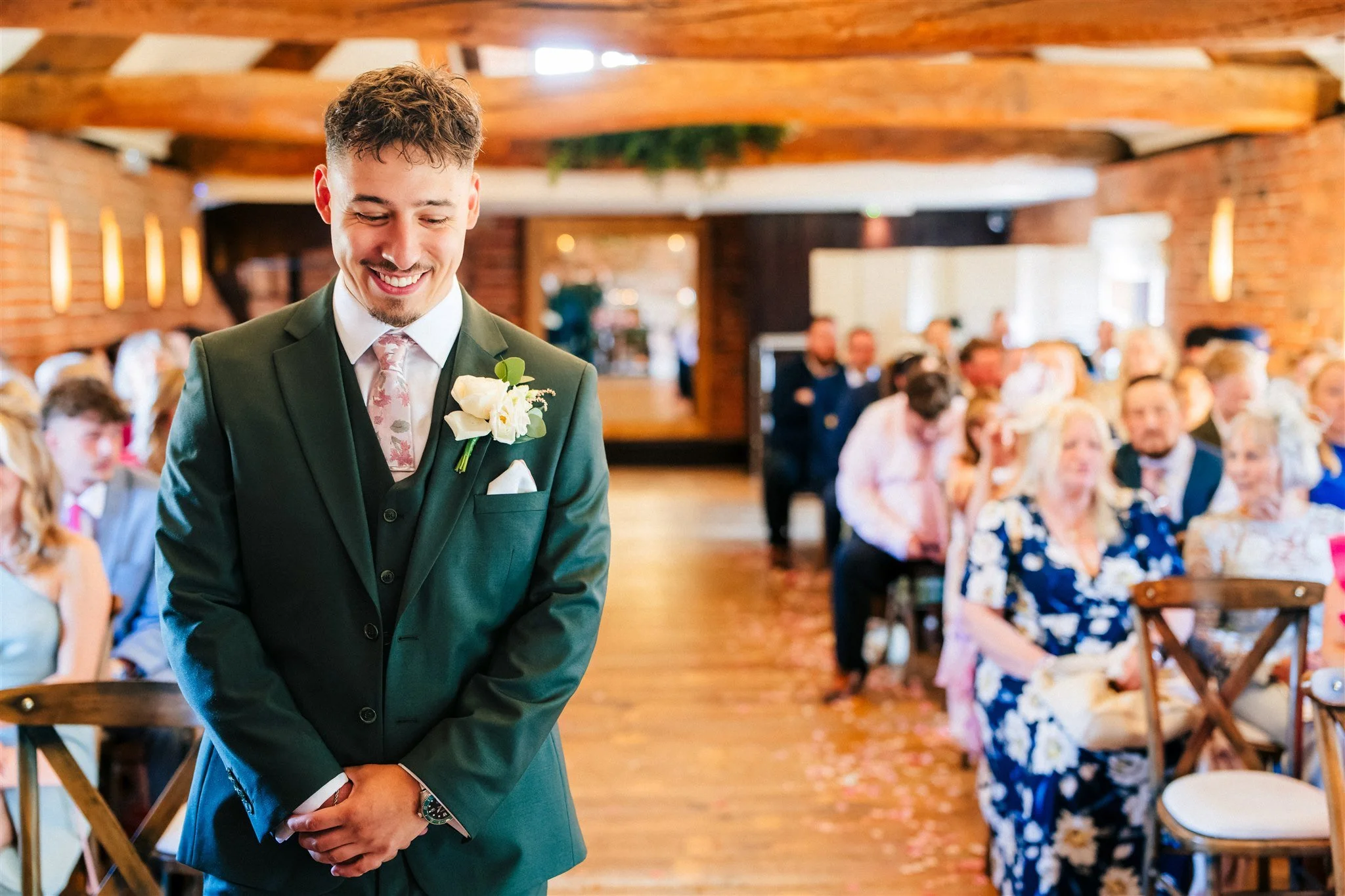 The groom waiting patiently for the bride to arrive and walk down the aisle