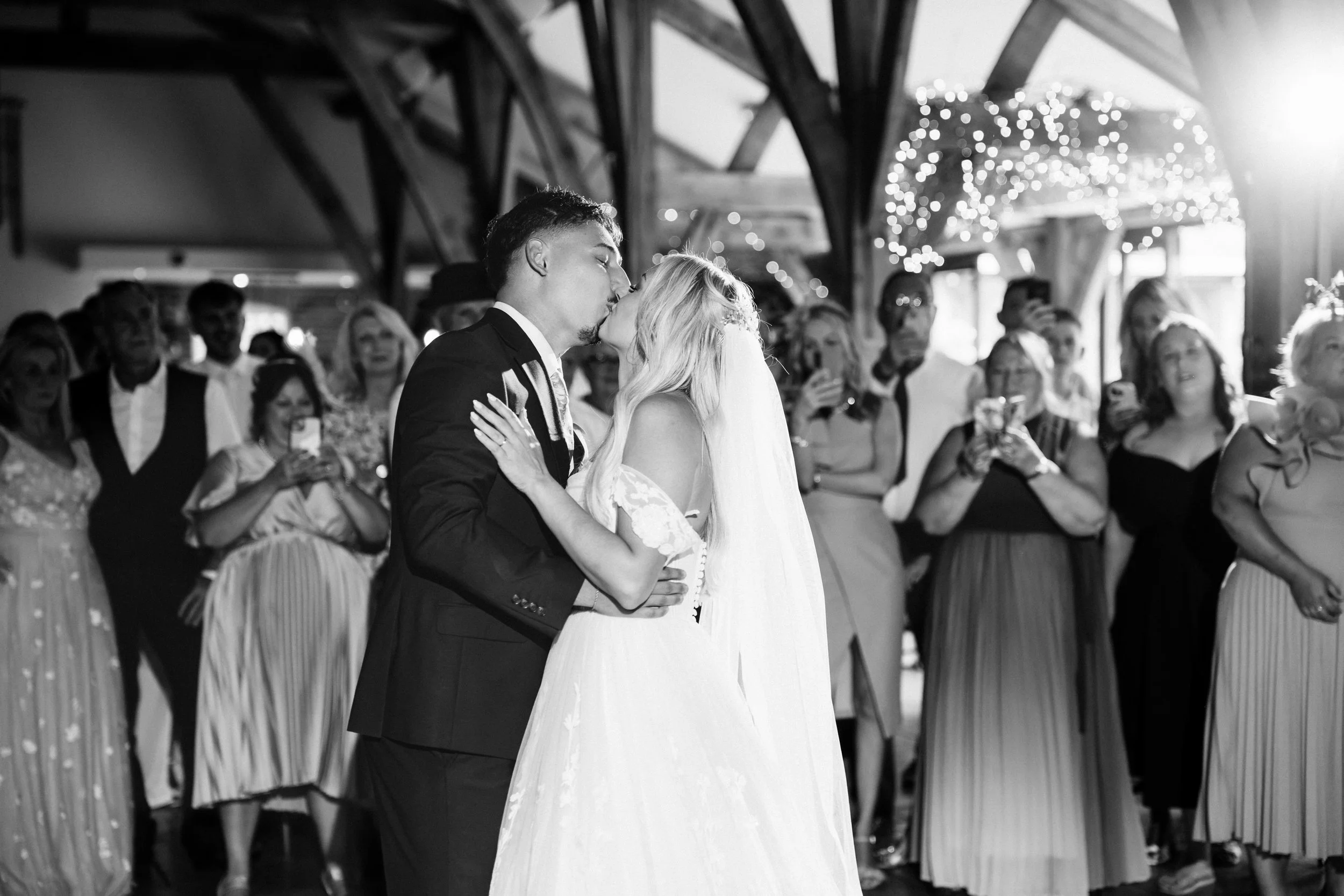 SWANCAR FARM WEDDING PHOTOGRAPHY - bride and groom kissing during their wedding first dance