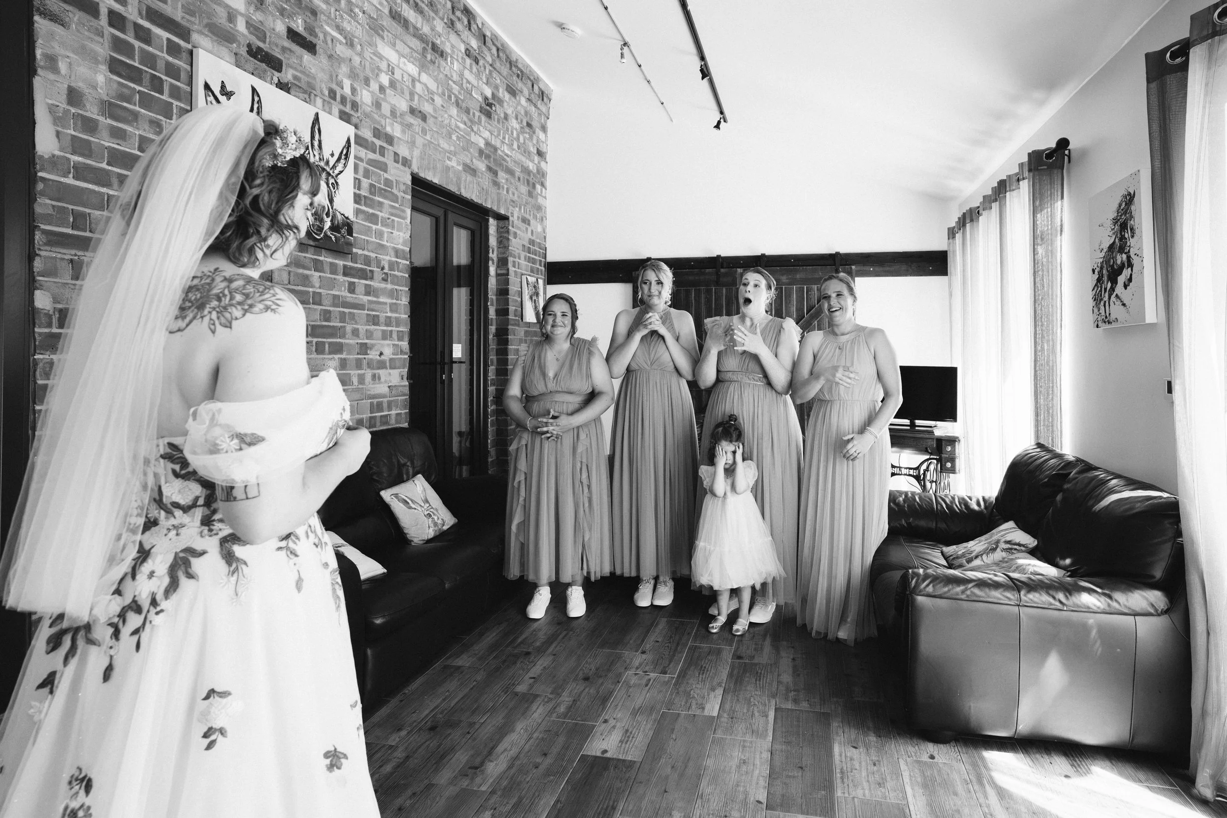 PHEASANTRY BREWERY WEDDING PHOTOGRAPHER - bridesmaids reaction to seeing the bride in her wedding dress