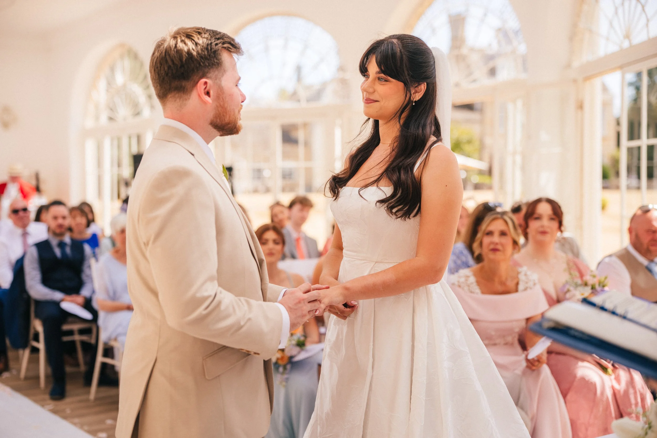 BARTON HALL WEDDING PHOTOGRAPHY - bride and groom exchanging rings during their wedding ceremony
