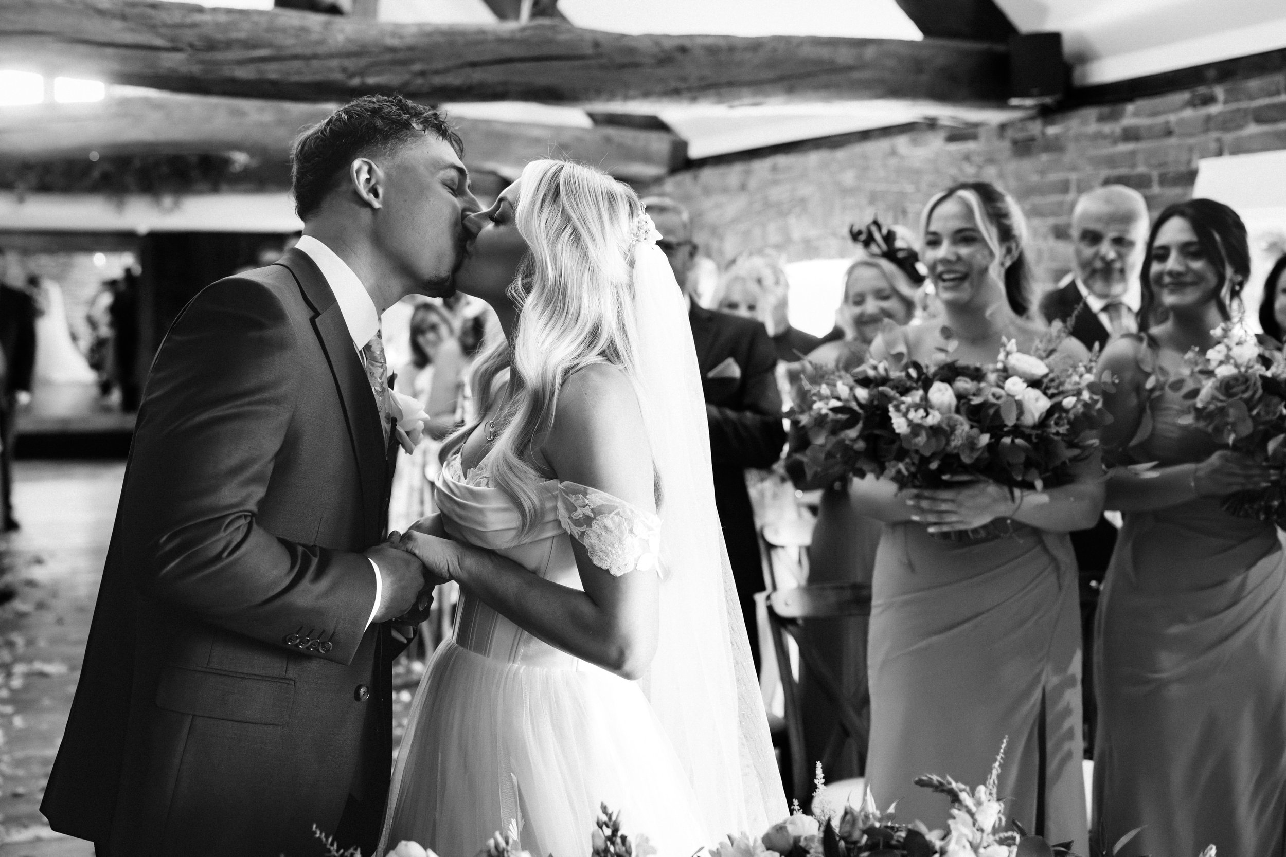 SWANCAR FARM WEDDING PHOTOGRAPHY - bride and groom kissing after their wedding ceremony